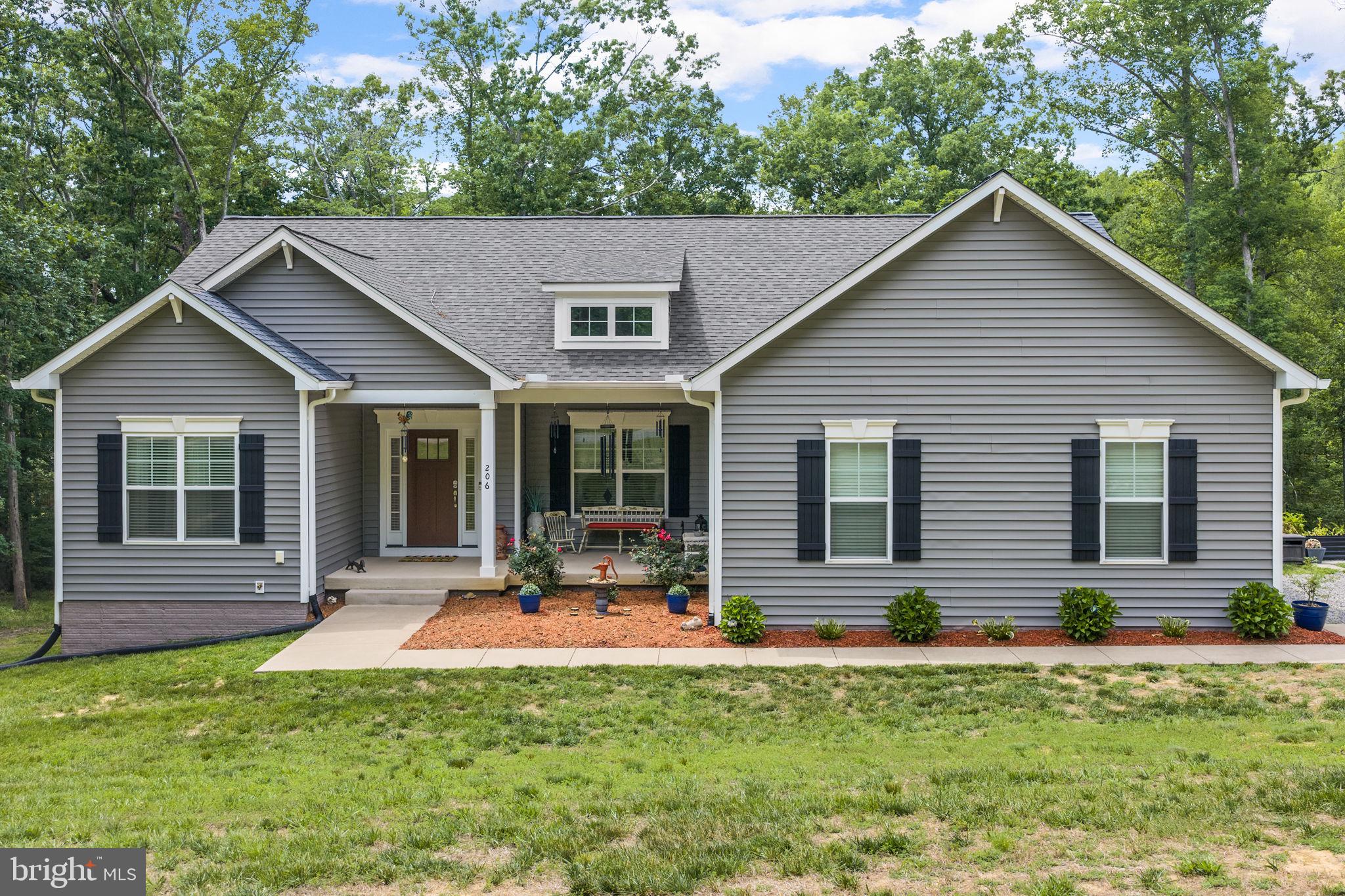 Lake Anna living starts here! This stunning Craftsman-style lake-access home, built in 2021, comes complete with a private in-ground saltwater pool and assigned boat slip B11 featuring a canopy and lift. Loaded with upgrades and perfectly positioned in The Waters at Lake Anna, one of the most desirable communities on the private side of Lake Anna. Life here feels like a resort. Enjoy an in-ground pool, sandy beach, clubhouse, boat ramp, tennis, pickleball, basketball, playground, and more. This home offers over 5,000 square feet with 3 bedrooms, 3.5 baths, a dedicated home office, and easy one-level living. The full unfinished walkout basement already includes a full bathroom and offers endless possibilities for future expansion, whether you're envisioning additional bedrooms, a recreation room, home theater, gym, or guest suite. Inside, the open floor plan is designed for both entertaining and everyday living. The spacious family room features vaulted ceilings and a beautiful shiplap gas fireplace, flowing seamlessly into the dining area and kitchen. The kitchen is sure to impress with a large center island, granite countertops, 4-burner gas cooktop, wall oven, stainless steel appliances, and a walk-in pantry. The main-level primary suite features a massive walk-in closet, double vanity, and an oversized tiled walk-in shower. LVP flooring throughout the main living areas. Two additional bedrooms, a full bath, home office, mudroom, laundry room, and powder room are also conveniently located on the main level. Step outside and discover your own private backyard paradise. Relax on the screened porch, entertain on the patio, gather around the fire pit, or cool off in the heated saltwater pool complete with a tanning ledge. The backyard offers the perfect setting for making memories with family and friends all summer long. Additional highlights include high-speed Firefly Fiber Internet, a whole-house Generac generator, attached two-car garage, storage shed, and beautifully maintained outdoor spaces. Short-term rentals are permitted, making this an excellent option for a primary residence, vacation getaway, or investment property. All of this in a golf cart friendly community that has been voted one of the best neighborhoods to live in year after year! Just minutes from groceries, dining, coffee shops, and local favorites like Lake Anna Taphouse and The Yacht Club. This one truly checks all the boxes.