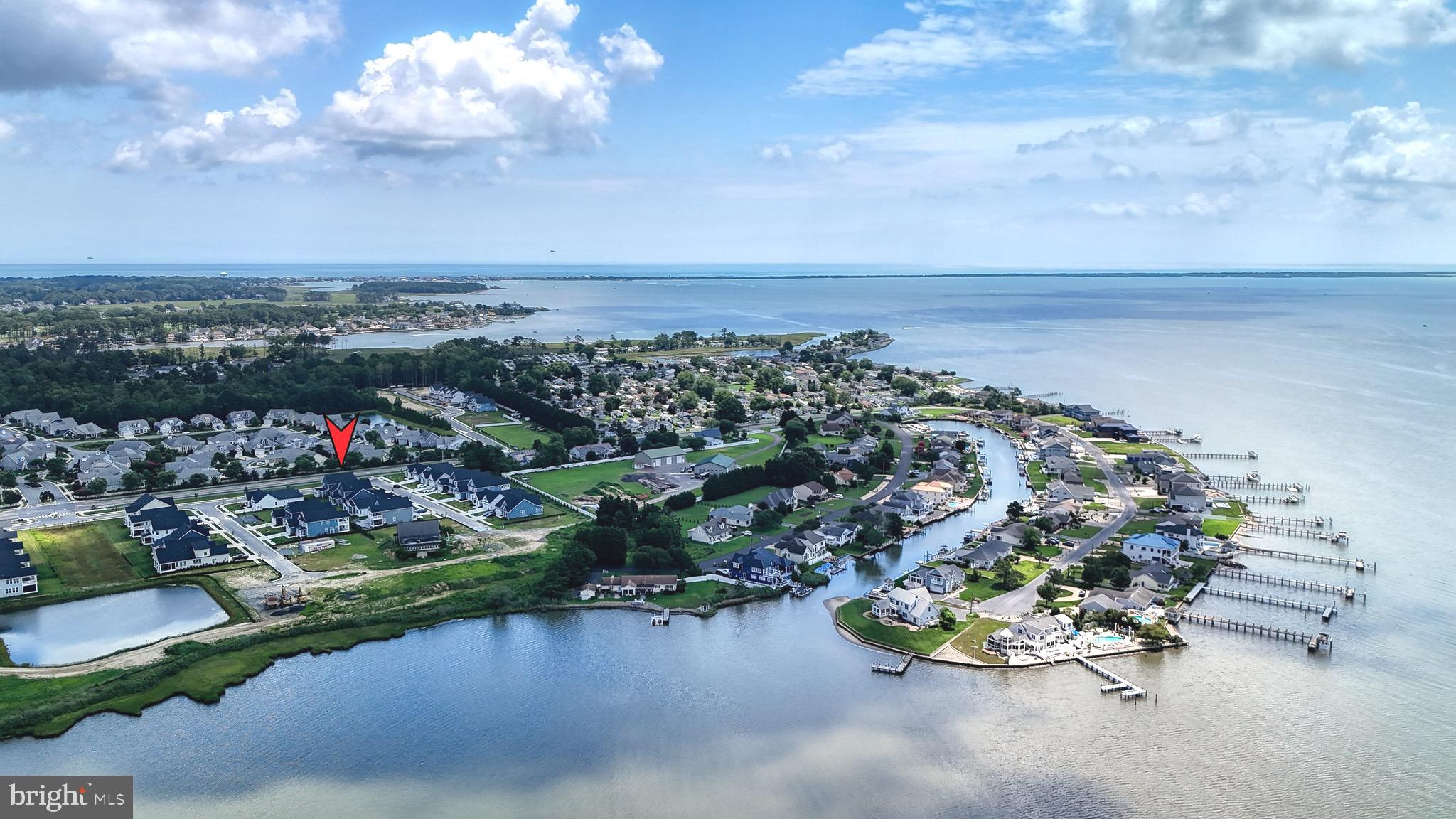Minutes to Downtown Rehoboth. Set along the tranquil Rehoboth Bay this waterfront community home offers a rare blend of elegance, comfort, and scenic beauty. Step into beachy luxury with this stunning home located in Osprey Point. No detail has been overlooked in the creation of this magnificent residence, this former model home effortlessly crafts a haven of beauty and comfort. Revel in the open concept kitchen and family room bathed in natural light. The gourmand's kitchen is appointed with oversized island, stainless appliances, gas cooking, pot filler, soft close cabinetry and quartz counter tops. A covered deck is located just off the dining area and is the perfect place to enjoy bay breezes. Bask in bay sunsets. The spacious first floor owner's suite is well appointed with a tray ceiling and ensuite bath. A second bedroom and full bathroom are also found on the first floor. An office is located by the entry door. Ascend the stairs to find a  loft that provides tons of flexible space. Two more bedrooms and a full bath round out the space nicely. Just minutes to all the sun, fun and dining Rehoboth Avenue offers! Community amenities include clubhouse, pool, pickleball and more. Check out the Video and 3D tour. Make your move!