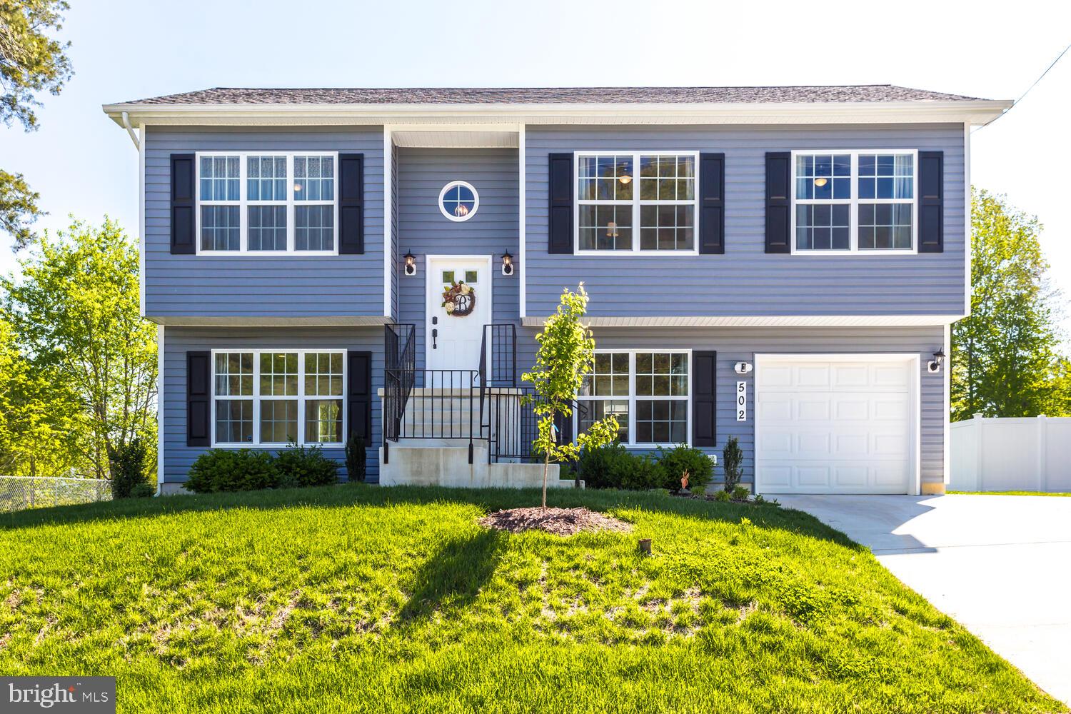 Beautiful home in Town of La Plata. Just like new! Home built in 2019 and shows very well.  Beautiful custom paint colors, rustic grey flooring, expresso kitchen cabinetry, granite counters & modern light fixtures through out. Spacious master bedroom on upper level + 2 additional bedrooms/ 2 full baths. Gorgeous Matching cabinetry and tile in all bathrooms. Lower level walks out to backyard oasis, large flat yard that is perfect for entertaining & bonfires. Bonus: Spacious laundry room w/ lots of storage. NO HOA!  This home sits nicely in the Town of La Plata, enjoy summer concerts at Town Hall or Holiday parades. Walking distance to local park. Take a peek soon, you don't want to miss out!