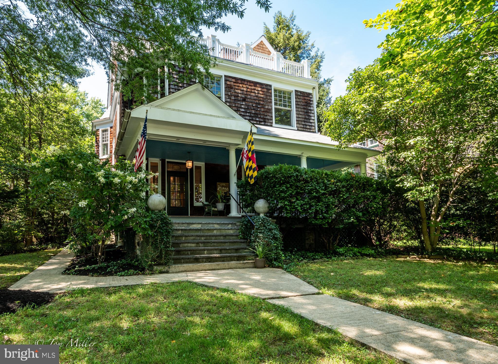 GORGEOUS ROLAND PARK GEM! This WONDERFUL 6 Bed/ 3  1/2  Bath HISTORIC HOME built in 1900 w/ over 3500  SQUARE FEET w/ TURN-OF-THE-CENTURY Character & Charm has MANY WONDERFUL UPDATES... NEW ROOF (2016), Fabulous  NEW COTTAGE WINDOWS (2017), Fantastic NEW IPE (COVERED) FRONT PORCH  DECKING (2018), NEWLY REFINISHED FLOORS, FRESH PAINT THROUGHOUT,  10+ FOOT CEILINGS on 1st Floor,  SPACIOUS LOVELY LIVING ROOM, SEPARATE GORGEOUS DINING ROOM, DEN w/ Wood Burning FIREPLACE, EXPANSIVE EAT-IN KITCHEN w/ Wood Stove, GRANITE Peninsula, STAINLESS STEEL APPLIANCES & SHAKER STYLE CABINETS,  REFRESHED BATHROOMS, WONDERFUL FLAT LANDSCAPED FENCED YARD with BRICK PATIO, Detached 2 Car GARAGE and SO MUCH MORE! NOT TO BE MISSED! Schedule a showing TODAY!