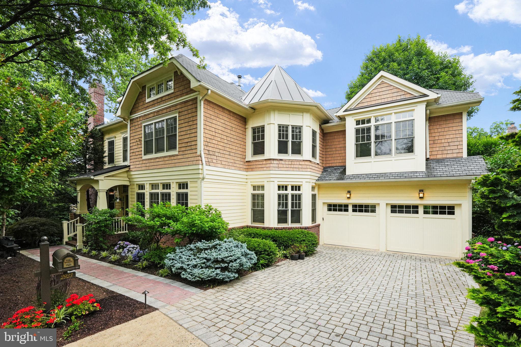 Nestled in the desirable Woodmont neighborhood of Arlington, VA, at the end of a serene oak-lined cul-de-sac, this stunning home at 2923 24th Rd N epitomizes modern living with quality and style. Nearly new and meticulously maintained, the property has been enhanced with significant upgrades over the past three years, ensuring comfort and convenience. Notable updates include a fully renovated kitchen that is a chef's dream, upgraded basement features, including a home gym with rubber flooring and mirrors, and new brick pathway and lighting leading to this stunning home. The home’s inviting living room features an new atrium door that opens to a spacious deck, complete with stairs leading down to a beautifully designed lower-level patio. This outdoor oasis is surrounded by elegant stone walls, creating the perfect setting for relaxation. Inside, the home offers welcoming spaces characterized by high ceilings, abundant natural light from tall windows, and well-proportioned rooms. The thoughtful design includes built-ins, plantation shutters, tasteful window treatments, and a lawn sprinkler system, all contributing to the home’s almost-new appeal. The upper level of the home features four spacious bedrooms, each with its own private bath, ensuring comfort and privacy for all residents. Additionally, a convenient laundry area and linen closet add to the functionality of this floor. Enjoy scenic tree views from every window, creating a serene and peaceful atmosphere. The versatile top floor includes a flexible bedroom suite, perfect for guests or as a private retreat. The daylight walkout lower level offers a spacious rec-room, ideal for media, games, and entertaining. This level opens to a private patio and connects seamlessly to the main level deck. A bedroom and bathroom complete this level, providing additional living space. This location boasts easy access to the Woodmont playground and recreation center, Windy Run trails, Donaldson Run swimming pool, and the vibrant shops and restaurants of Clarendon, ensuring that there are no boring weekends here. Conveniently located just two lights away from Washington, DC, this prime location offers quick access to the Custis Bike Trail, the Pentagon, the Rosslyn-Ballston business corridor, Crystal City, Fort Myer, and Ronald Reagan Washington National Airport. The location is unbeatable for both work and leisure. This home at 2923 24th Rd N is a must-see for anyone looking for a blend of modern living and convenience in a desirable Arlington neighborhood.