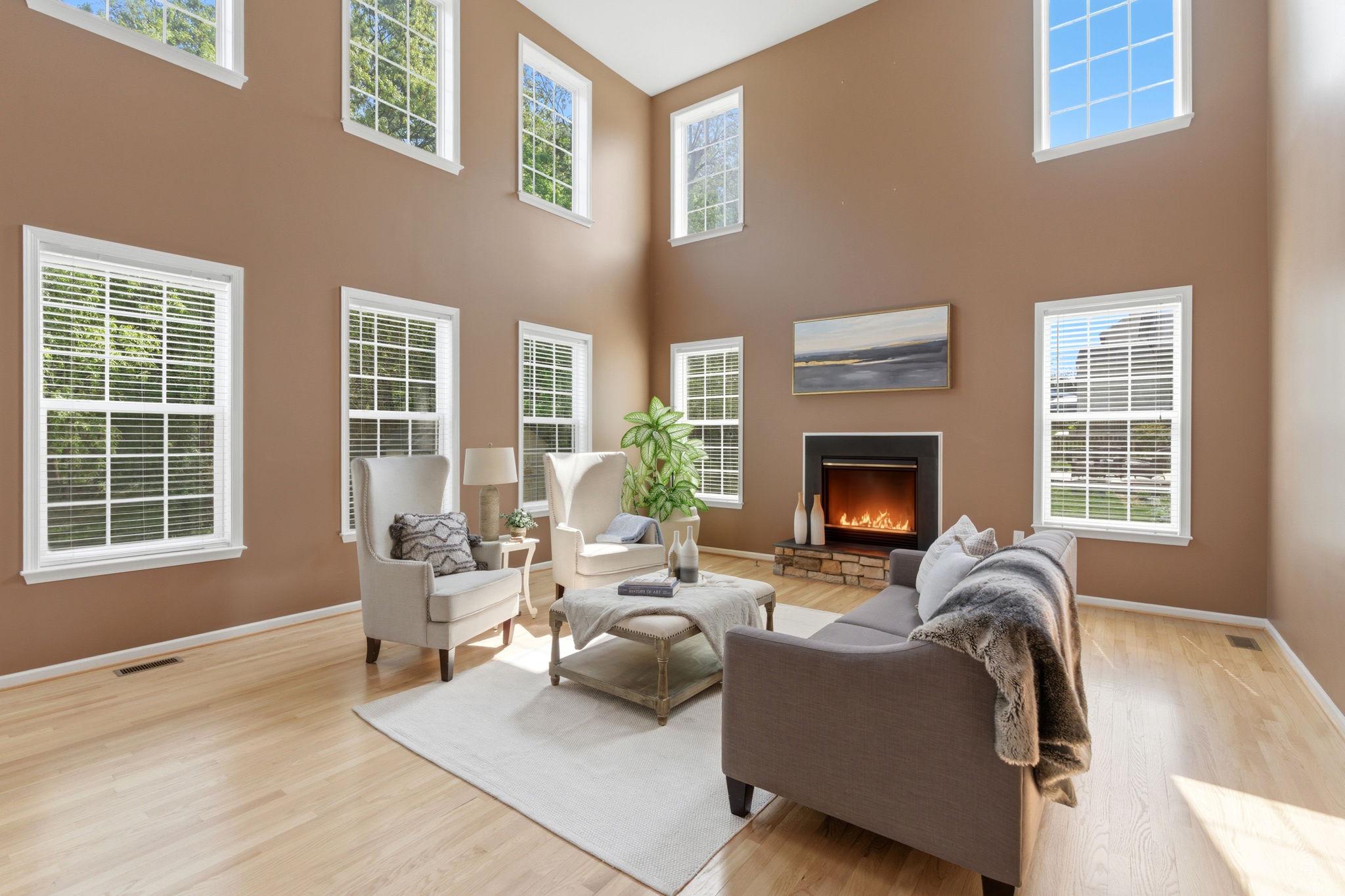 MOTIVATED SELLERS! Don’t let the exterior fool you—this is the LARGEST MODEL in the neighborhood, offering an incredible amount of space and openness that truly has to be seen in person to be appreciated. 
Welcome to 457 Hughs Rd, a spacious three-level single-family home offering ****5,166**** total square feet, including 3,566 square feet above grade. Featuring 4 bedrooms and 4.5 bathrooms (two ensuite bedrooms), this property offers exceptional interior space, a functional layout, and recent system updates.
From the moment you enter the front door, the home creates a strong first impression with its expansive feel, enhanced by vaulted ceilings and an open layout that brings in natural light. The main level includes a living room with a fireplace that serves as a comfortable central gathering space. Newly sanded and refinished floors add a fresh and updated look throughout. The kitchen has been updated with new countertops and provides direct flow to the surrounding living and dining areas, supporting both everyday living and entertaining. A dedicated office on the main level offers flexibility for remote work or additional use. There is also walk-out access to a refinished deck that overlooks the private, tree-lined backyard.
The upper level includes generously sized bedrooms, including two ensuite bedrooms, providing added privacy and flexibility for guests or multi-generational living. Multiple full bathrooms on this level enhance convenience and functionality.
The finished lower level adds significant additional living space suitable for a recreation room, home theater room, home office, fitness area, or guest accommodations.
Recent improvements include a new heat pump in 2025, roof in 2018, new refinished flooring, new kitchen countertops, and a new front entry door. These updates contribute to improved efficiency, reduced maintenance, and long-term value.
Situated on a 0.23-acre lot, the backyard is lined with mature trees that create natural privacy. Additional features include a two-car garage and three finished levels of living space.
The location offers strong convenience, situated minutes from Route 340 and Route 9, walkable to Washington High School, and within commuting distance to Washington, DC and Northern Virginia. Come to the open house, or call for a private tour today!!