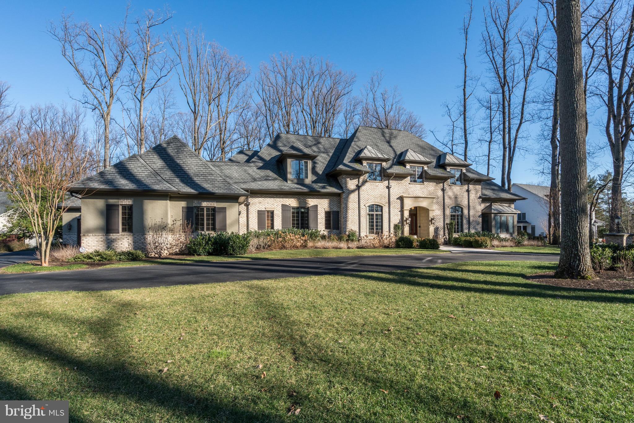 Remarkable custom home on one acre in sought after Woodhaven with a circular Driveway, 3-car Garage, and fully fenced Backyard with a covered Porch that has a masonry gas Fireplace. The interior features a main level Master Suite with his & hers walk-in Closets and Baths, large Formal Living Room and Dining Room, two Study/Offices, custom Wet Bar that opens to the Family Room. Grand Kitchen has two islands, top-of-the-line appliances, Breakfast Room and Morning Room. Upper Level boasts 3 Bedroom Suites and a Sitting Room with Wet Bar. Lower Level features a large Recreation Room, Wet Bar, Fitness Room, two Bedroom suites with Living area and two full Baths.