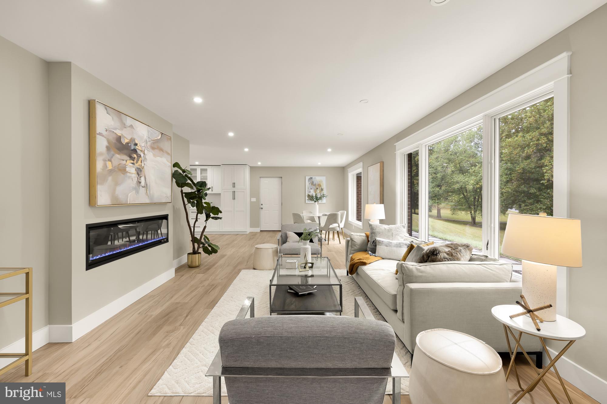 Welcome to 1325 Patuxent Drive, where a completely reimagined interior meets the beauty of a private, tree-lined setting on an exceptional 2-acre property. Offering approximately 4,160 square feet of finished living space, this residence has been thoughtfully updated with modern design, open flow, and top-of-the-line finishes throughout.

Inside, light-filled rooms showcase wide-plank flooring, recessed lighting, and a sleek fireplace that creates a warm and inviting ambiance. The gourmet kitchen serves as the heart of the home, featuring an oversized island, quartz countertops, custom cabinetry, and stainless steel appliances, all opening seamlessly to the dining and living areas. Luxurious bathrooms are appointed with striking tilework, including elegant gold tile accents, and contemporary fixtures. Spacious bedrooms feature custom closet systems for effortless organization, while Bluetooth-enabled ceiling fans add modern comfort and convenience.

The fully finished lower level offers endless versatility, whether used as a media room, home office, fitness space, or guest suite with a full bath. Outdoors, a new stone porch and patio overlook the expansive fenced yard, surrounded by mature trees and professional landscaping. The property also features a certified wildlife pond, creating a peaceful natural retreat right in your backyard. Recent improvements include new gutters and outdoor lighting that enhance both functionality and curb appeal.

Additional highlights include an oversized garage, resurfaced driveway, and a detached Morton building with electricity, ideal for hobbies, equipment storage, workshop space, or a home-based business. With pre-wiring for a whole-house generator and smart home conveniences throughout, this property seamlessly blends luxury, function, and peace of mind. A rare opportunity for a discerning buyer seeking space, privacy, natural beauty, and a truly move-in-ready home in sought-after Ashton.