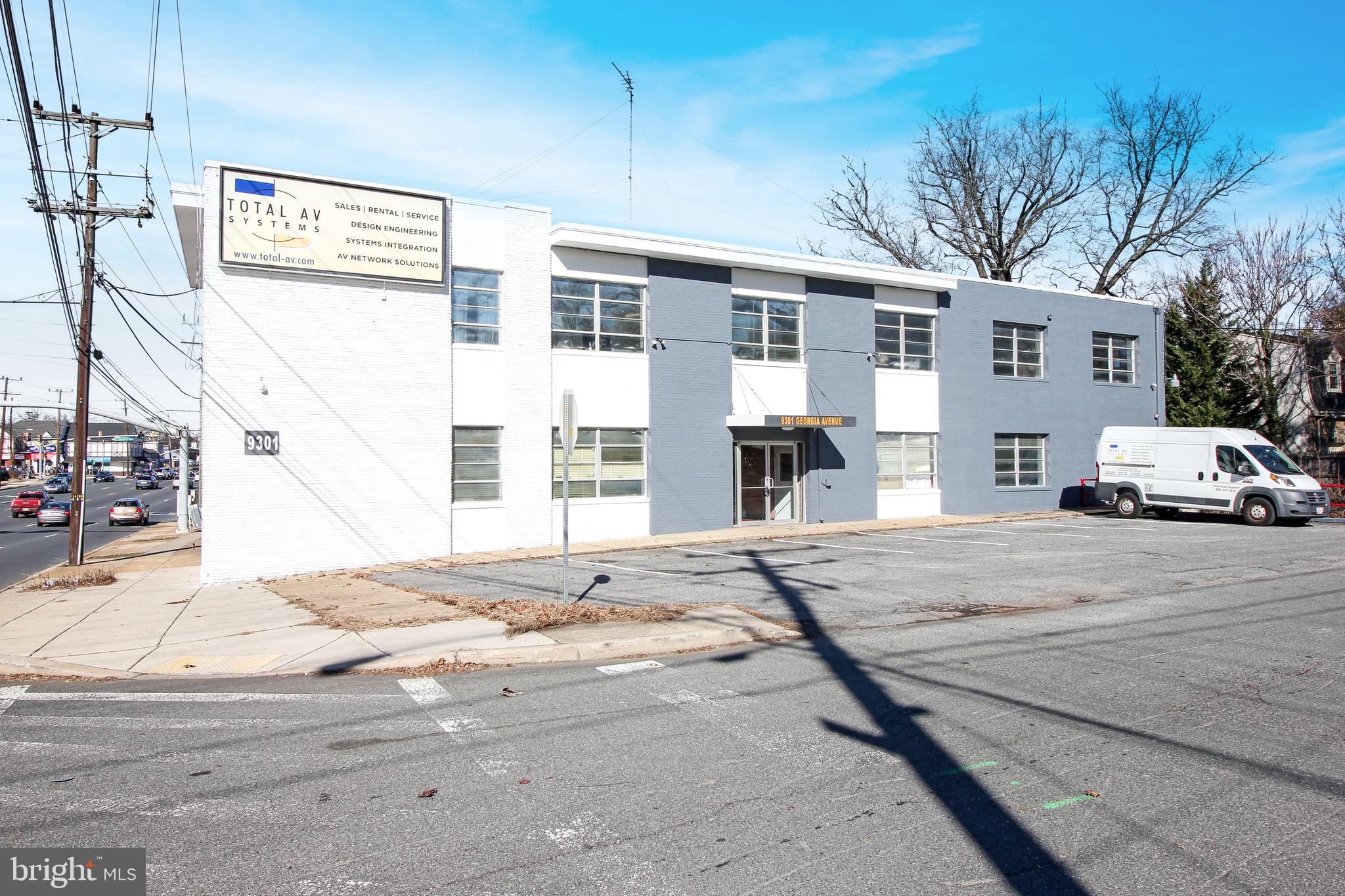 Solid brick corner street two level building with great visibility on Georgia Ave. Unit 1 is the bottom right quadrant approx. 1550 sqft of open space.  Two shared restrooms. Rent + NNN. Was used as a church can be converted. Private parking for 8 vehicles shared among the building tenants. Public parking on the street and public metered parking 1.5 blocks away. Lot across the street is private and owner will not rent.