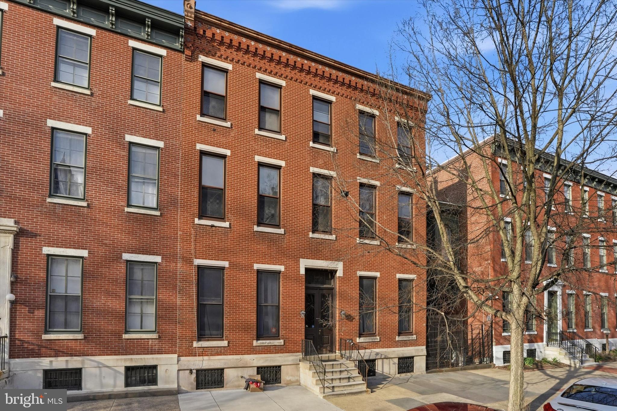 Welcome to this charming tri-level residence nestled in the heart of Historic Spring Garden, perfectly positioned on picturesque, tree-lined Green Street. Set within an elegant, stately brick building of just six residences, this home offers a rare blend of privacy, character, and timeless architectural detail—complete with a serene shared courtyard.

Enter on the second floor into a sun-drenched living space that immediately impresses with soaring 10+ foot ceilings, rich hardwood flooring, and refined finishes throughout. The living and dining areas are accented by triple crown molding, oversized baseboards, deep-set windows with classic wainscoting, and a stunning decorative fireplace with a marble mantle—creating a warm yet sophisticated atmosphere.

The thoughtfully updated kitchen combines style and functionality, now featuring new stainless steel appliances, sleek cabinetry, a farmhouse sink with gooseneck faucet, and tasteful tile flooring and backsplash.

Upstairs, the second level offers a spacious bedroom retreat with hardwood floors and two closets plus an for exceptional storage. Two oversized windows provide peaceful views of the courtyard. Just outside the full bath, custom built-in shelving adds both charm and convenience. The bathroom itself features a penny tile floor, pedestal sink, and a tiled tub/shower combination.

The top level is a true standout—flooded with natural light from a full wall of windows showcasing beautiful city views. This versatile space is perfect as a home office, den, or guest suite.

Additional highlights include dedicated basement storage and an unbeatable location. Enjoy easy access to Whole Foods, neighborhood favorites, acclaimed dining, and cultural landmarks including the Rodin Museum, Barnes Foundation, Philadelphia Museum of Art, and the scenic Schuylkill River Trail.  The entire home was just repainted and ready to move into!  

A rare opportunity to own a character-filled home in one of Philadelphia’s most desirable neighborhoods—this one truly checks all the boxes.