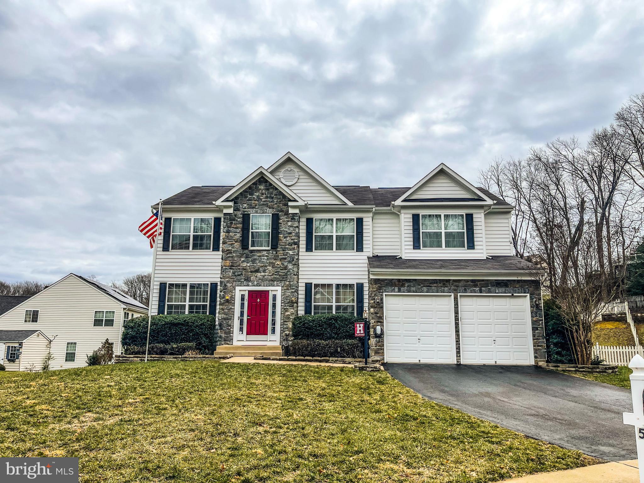 Gorgeous Colonial in Leeland Station - A Must-See! Ready for its new owners and nestled on a quiet cul-de-sac lot.  Once you enter, the foyer welcomes you to the formal living room on the left and the formal dining room on the right—perfect for entertaining guests as they arrive.

As you continue through the home, the spacious two-story family room featuring a striking stone fireplace draws your eye.  With large windows that stretch up to 18-foot ceilings, and plenty of room for relaxation, this will be one of your most used spaces in the home.  Flowing through the family room is the kitchen that boasts white cabinetry, a large island with extra seating, dual wall ovens, cooktop, a large pantry, and a built-in desk area—ideal for cooking, entertaining, or simply making memories.  Opposite the kitchen side, you'll find a private study with glass doors making the room great for working or studying at home.

Upstairs, the hallway balcony overlooks the main level two story family room.  The primary bedroom suite is both spacious and inviting, offering a large walk-in closet and a private bath with dual sinks, a large corner shower, a corner tub, and a separate toilet area. Three generously sized additional upper-level bedrooms, a large full hallway bathroom and laundry room complete this level.  

The finished basement features a large recreation room with a wet-bar rough-in perfect for an exercise area or entertaining, the 5th bedroom with an egress window, and a 3rd full bathroom. There's also a storage and utility room for added convenience.

Love entertaining outdoors? Step out through the back door from the kitchen onto a multi-level deck with built-in lighting that overlooks the fenced backyard, a great space for outdoor activities, BBQ's and exercise.

This established neighborhood is loaded with community amenities and is conveniently located just a 2-minute drive to the Leeland VRE station, close to shopping, schools.  High speed internet available. 

You won’t want to miss this one!