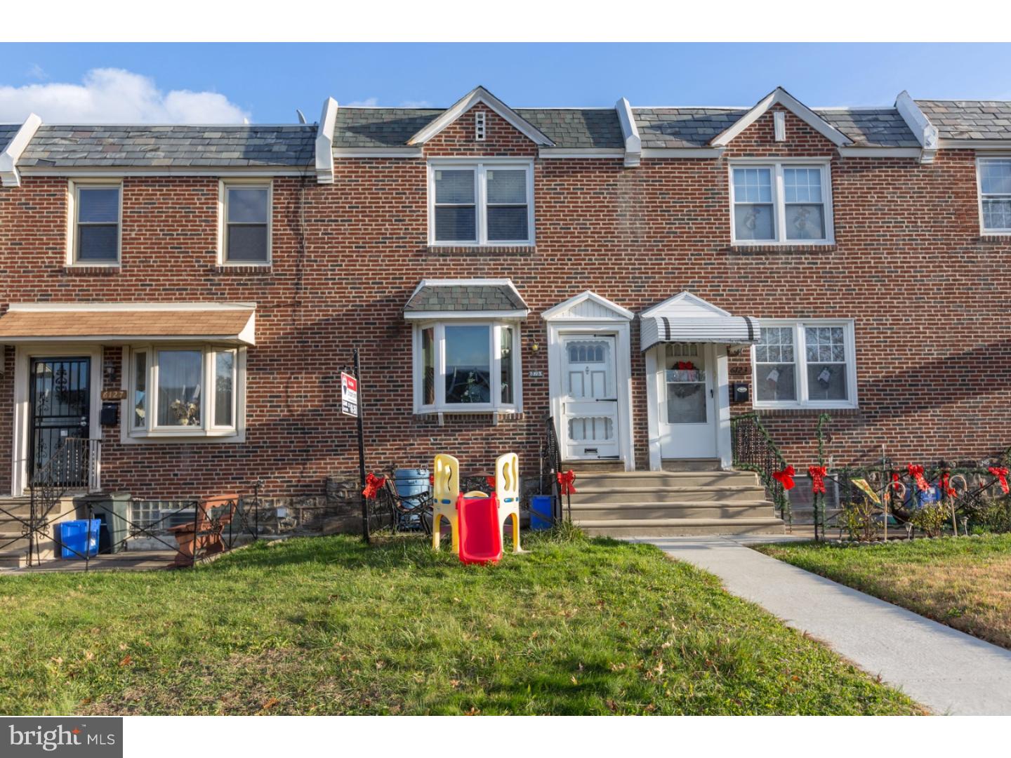 We are in love with this amazing Lawncrest home with 3 bedrooms, 2 full high-end renovated baths, a huge finished basement, 1 car parking, a large walk out deck, upscale and upgraded throughout and so many details to enjoy we are just bursting with excitement! Enter into a charming brick from home with front patio and lawn. Inside you will see beautiful original solid wood parquet floors in fantastic condition from the living room through to the formal dining room. The living room is spacious with a bonus built-in cabinet to hide those extra candles, coasters, and remotes when you are not using them. The dining room is filled with natural light from the slider doors leading to that amazing deck allowing for floor-to-table grilling year round and memorable outdoor celebrations. The kitchen is a joy for anyone who likes to cook with plenty of prep space on the beautifully beveled edge counter tops. There are several upgraded shelving additions in this kitchen for your cookbooks and show worthy kitchenware.  There is a breakfast bar and all appliances are included. The lower level finished basement can be a 4th bedroom with a magnificent spa inspired full bath, decorative pebble and ceramic tile work, and a storage vanity. The 2nd floor has 3 bedrooms with ample closet space, the master bedroom includes an upgraded shelving above the closets, and the hall bath is completely renovated with a stylish glass vessel sink and flooded with natural light from the skylight. Recessed lighting, central air, and ready for your visit. Located in walking distance to the Lawndale Train Station/Fox Chase Line, minutes from the Melrose Country Club/Golf Course, Lawncrest Park/Recreation Center, Lawncrest Library, and close to the walking trails of Tacony Creek and Fairmont Park.
