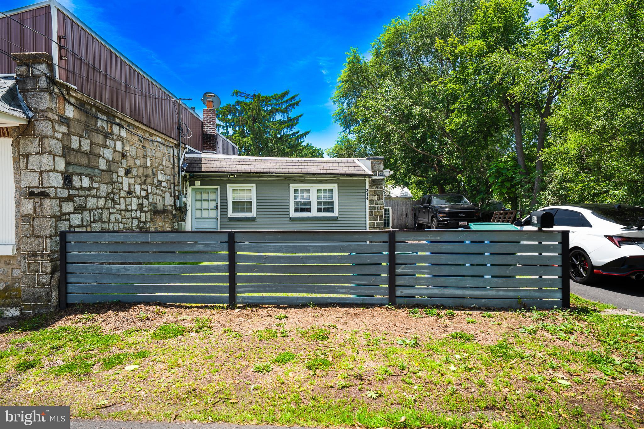 This is a move-in-ready Croydon home with major updates and an outdoor space that truly sets it apart.

Welcome to 314 Wynnewood Avenue, a beautifully updated 1-bedroom, 1-bath bungalow offering comfort, style, and impressive indoor-outdoor living. This charming home features a newly remodeled kitchen with modern cabinetry, stainless steel appliances, subway tile backsplash, quartz countertops, and great functionality for everyday living.

The newly remodeled bathroom offers a clean, modern look with updated tile flooring, contemporary fixtures, and a sleek vanity. The bedroom is spacious and comfortable, while the inviting living room provides a cozy place to relax with stylish flooring, recessed lighting, and a warm, modern feel throughout.
Step outside and enjoy one of the home’s best features: the incredible backyard setup. The fully fenced yard offers excellent privacy and plenty of space to entertain, relax, or unwind. Enjoy the large paver patio, outdoor sectional seating area, hot tub, covered bar area with seating, outdoor TV, and plenty of room for gatherings. Whether you are hosting friends, watching the game, or enjoying a quiet evening outside, this backyard is built for entertaining.

Additional highlights include a separate main-floor laundry room, ductless mini-split systems, a large driveway with ample parking, a storage shed, and a low-maintenance layout. The property sits on approximately 0.13 acres and offers approximately 726 square feet of living space.