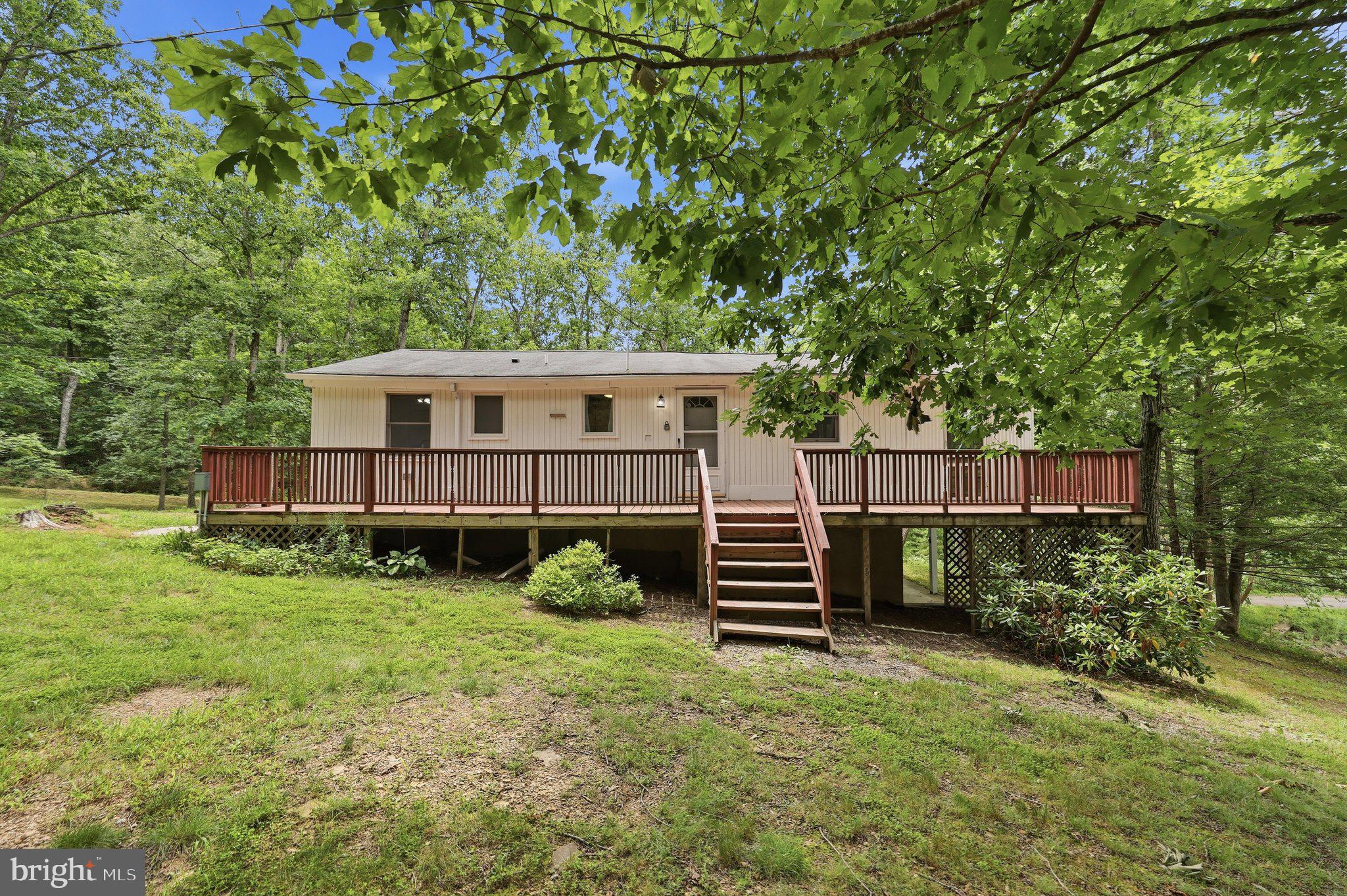 Perfect Airbnb investment opportunity! In recent years, this property has generated an average of $38,000 in annual rental income.

Welcome to this charming cottage retreat, ideally situated in a peaceful setting at 371 Oak Hill Road. This cozy home offers the perfect escape, featuring access to a serene community pond, an inviting fire pit, and a relaxing screened porch—ideal for quiet mornings or evening gatherings.

Inside, you’ll find a warm and welcoming atmosphere highlighted by a fireplace, enhancing the home’s comfortable cottage charm. The property features two spacious bedrooms, one full bathroom, a large family room, an upscale kitchen, and a dedicated laundry room. With the option to relocate the laundry to the lower level, there is potential to create a third bedroom upstairs—adding even more value and flexibility.

A perfect blend of charm, tranquility, and income potential—this property truly has it all!