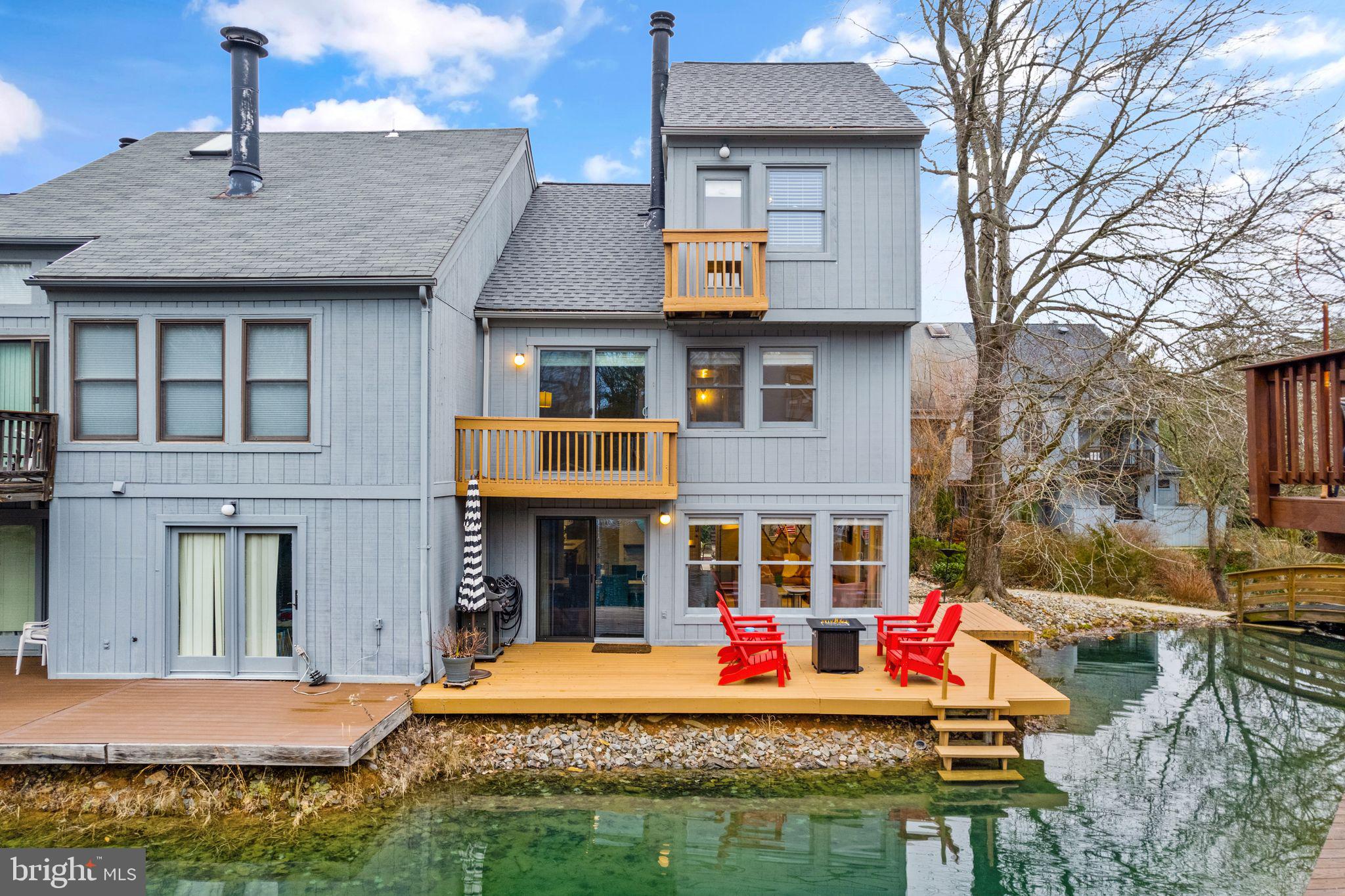 Nestled in the highly coveted community of The Wharf in Reston, 11148 Glade Drive presents an exceptional 3-level townhome that provides a resort-like waterfront living experience. Upon entering, you'll be greeted by an airy and contemporary floor plan featuring beautiful wood ceilings, hardwood floors, and picturesque views. Boasting 4 bedrooms, 2.5 bathrooms, and a 2-car garage, this home is a true gem.

The kitchen features quartz countertops, stainless steel appliances, white cabinets, and a marble backsplash. The flexible living and dining areas are perfect for entertaining, offering mesmerizing waterfront views and direct access to the deck. Enjoy the cozy ambiance of a wood-burning fireplace on chilly winter nights. The wraparound deck is an ideal spot for unwinding while enjoying the serene melodies of the fountains.

The second level features three bedrooms with vaulted ceilings, a hall bathroom, and convenient laundry room. Your guests will love the lagoon views from their bedroom.


Ascend to the roomy third level, where the owner's suite awaits with striking vaulted ceilings, an upgraded bathroom, and three closets! Begin each day by stepping onto your private balcony that offers views of the lagoon and fountains.


Experience the unique charm of this home, where ample outdoor space invites both entertaining and relaxation, creating a vacation-like retreat. Jump right into the lagoon from your deck for swimming, paddleboarding, fishing, and even ice skating.

Ideally situated in close proximity to Lake Audubon, Walker Nature Center, South Lakes Village Center with its shops and restaurants, and the Wiehle-Reston Metro, this home is also surrounded by the array of Reston Association amenities. Enjoy access to pools, tennis courts, and extensive nature trails, fully immersing yourself in Reston's vibrant "Live, Work, Play" lifestyle!
