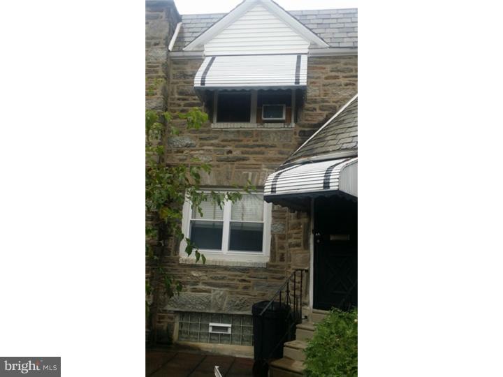 Price reflects condition. Hardwood floors under carpets. Large stone house on wide block. Needs updating.