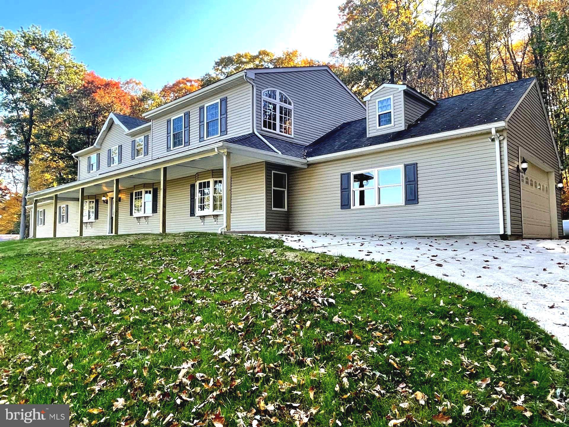 LOOKING   for an  All-in-One Dream Home with a Heated Indoor Pool and Loads of Garage Parking  located in Beautiful Lancaster County?  START Right Here where Rural Living is literally, "Picture Perfect."  This Impressive and Sprawling  Colonial  Style Home has 6 Bedrooms, 4.5 Bathrooms,  A Comfortable Kitchen Layout  with two Slider Doors and spans 33 ft in  length  and adjoins an Amazing Heated Indoor Pool with Entry steps into the Crystal blue water and Heated Flooring surround + Starburst windows and Skylights will let you Forget about the Colder Days ahead. From the Pool area is an Attached Stone floored Hallway leading to a 2-Car garage on the Left and then Entry in the Vast sized 64X40 Building  with 16 ft Doors with Metal Roof, has new ceiling-lighting,  Lengthy Service  Pit and great  space  for RV's, Work trucks , Boats, Buggies,  Or a Numerous amount of vehicles!. It's Absolutely perfect for any Car Enthusiast!!
The Main level also offers Living Room , Family Room and Separate Dining room which  are enhanced with Bow Windows and  have gorgeous  Farmland views. The Covered Front Porch enhances the Profile of the home which spans  60 ft and adds a Relaxing  Setting.  The Main Level includes  2- Bedrooms , 1-Full Bath with a Curved Door step-in shower and granite top vanity, a spacious Laundry Room  with an  adjoining Half bath. The Laundry Room  is  conveniently attached to a 2-Car Garage.  Leading to the Upper level there are 2 separate and appealing Oak Staircases and this level  exhibits  4 Bedrooms,  3 Full Baths + Bonus  views overlooking the  Fabulous Indoor Pool.  Staircase to the Right has a  Lighted  Landing with Slider Door providing access to the Balcony overlooking the Tree-lined Courtyard. As you enter the Primary Bedroom  you will be surprised by Room Size, Wood Plank flooring, Vaulted Ceilings with Lighted Ceiling Fan,  Sunburst Style windows, with Multi-Closets and 1-Spacious Walk-in Closet. Primary Bath includes Jetted Tub , Low Profile Shower, Vanity and spacious.
The additional Three Bedrooms are Carpeted ( one with Dual Closets )  accompanied with another Full  Bath  with jetted tub and step-in shower vanity and the third Bathroom  has separate tub and shower. .... Loads of Rooms to Roam!
The entire basement cement flooring has been epoxy painted and All block walls have been totally dry-locked. This offers an Amazing amount of Storage Space which  has been designed well  to access  basement Utilities and an Outside access.  
Luxury Plank Vinyl Flooring , Carpet, Tile and Luxury Wood Plank Flooring are the key floor coverings installed throughout the Home.  All Garage Floors have  been Epoxy painted. There's So Much to See and appreciate in this Grand Home. Convenient to Grocery Stores, Banks, Restaurants + purchasing Farm Fresh Produce, Dairy Products and more. There's No Place Like Home! Don't Miss Out . Schedule your appointment Today!
