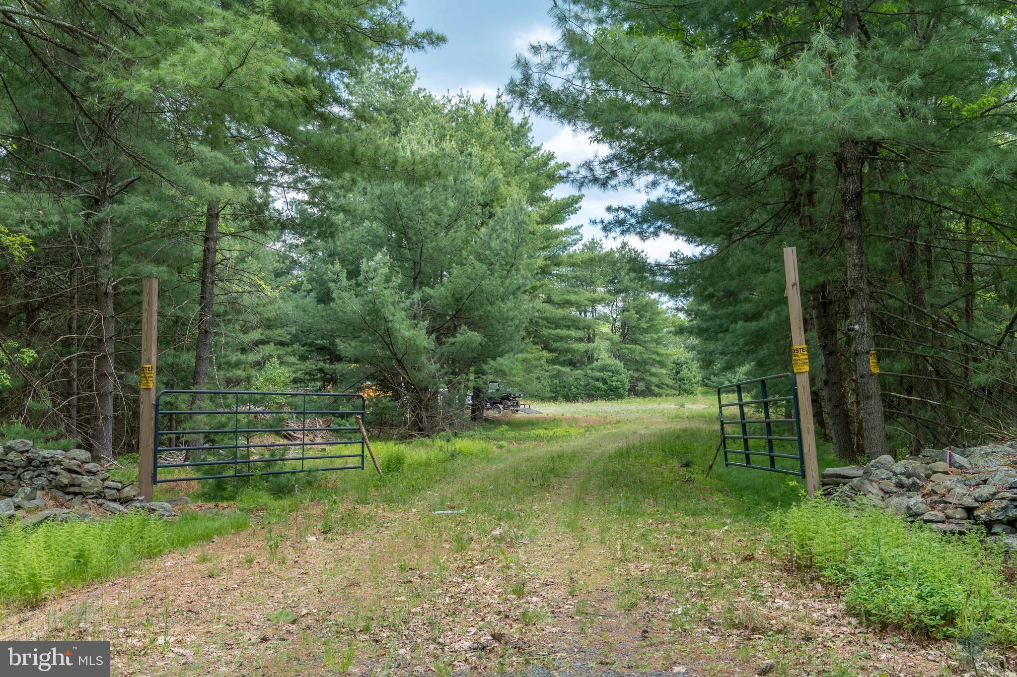 Exceptional 1,568 +/- acre property located on Thunder Mountain in Pike County, Pennsylvania. This large untouched parcel of land is only 50 miles from NYC, and close to Middleton, NY, Scranton, PA, Binghamton NY, and Philadelphia, PA.  It offers a rare combination of features, including open land, mature woods, springs, beautiful creeks with waterfalls and an overlook with stunning views spanning Pennsylvania, New Jersey and New York.

The property is highly versatile with 75% of the land featuring level or slightly rolling topography. The acreage consists of a rich mixture of hardwood and softwood timber, and the natural landscape includes several springs and creeks. Notably, Cummins Creek is a designated wild trout stream. This seclude yet rich acreage attracts a variety of wildlife such as deer, turkey, and bear. The property has trails and roughly 30 miles of roads throughout.

The land is already equipped with several functional improvements, including a large 35-acre cleared area with an extensive campsite featuring a 2021 Grand Design Recreational Vehi Solitude Fifth Wheel RV, pavilions, decks, a hot tub, and many gardens. The campsite is serviced by solar panels, a generac generator and a well. A septic plan for a 12 bedroom home has been designed and is ready to be installed. This provides an ideal location for a future dream home or cabin. Access is available via Heeters Hill Road or Cummins Hill Road, and the property includes a permit to build a bridge over Cummins Creek if needed. Deeded acreage is slightly lower but survey done in 2016 says 1568.87.

An environmental Phase 1 and a site feasibility study have already been completed by the owner.