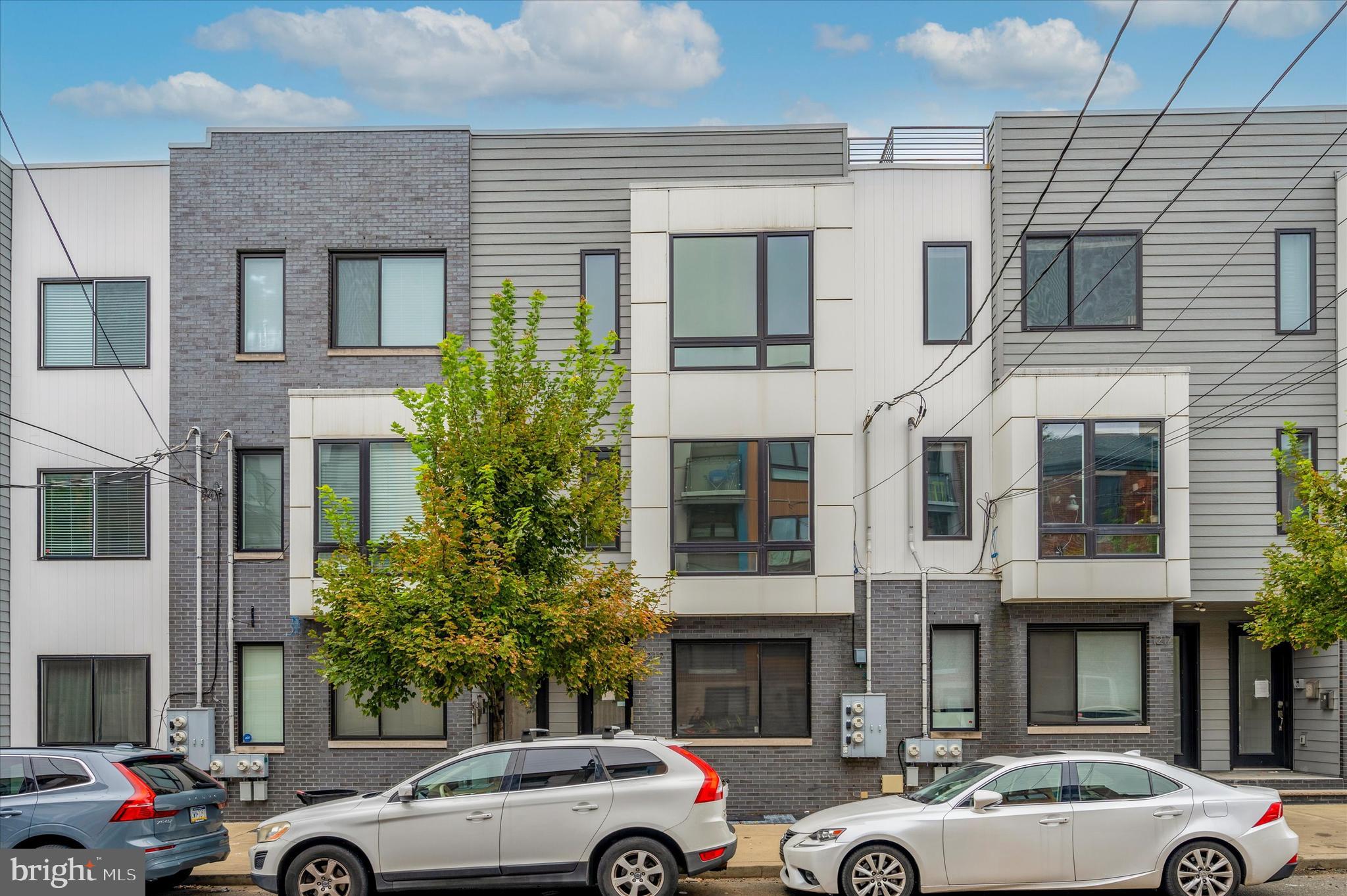 *****NOW OFFERING A $6,500 CREDIT!********A unique opportunity to own this gorgeous 3bd, 3ba home with ROOF DECK and PARKING. Sitting at the prime location right off Girard Ave, this almost new Olde Kensington home features a desirable open floor plan, with  hardwood floors throughout, large windows and tons of natural light! There is a nice sized bedroom and a full bath on the main level with spacious storage and closet. The second floor  features 2 spacious bedrooms with large closet spaces, one has its own full bath with double sink. There is another full bathroom in the hallway and a full size laundry. Upstairs is the stunning roof deck with great views to the city! Never worry about finding street parking, Park in your own space directly behind your building and walk into your back door! If you are a dog owner there is a conveniently located dog park in the rear!  Great walkability to all the retail, restaurants, and nightlife Northern Liberties and Fishtown has to offer. Schedule your showing now!