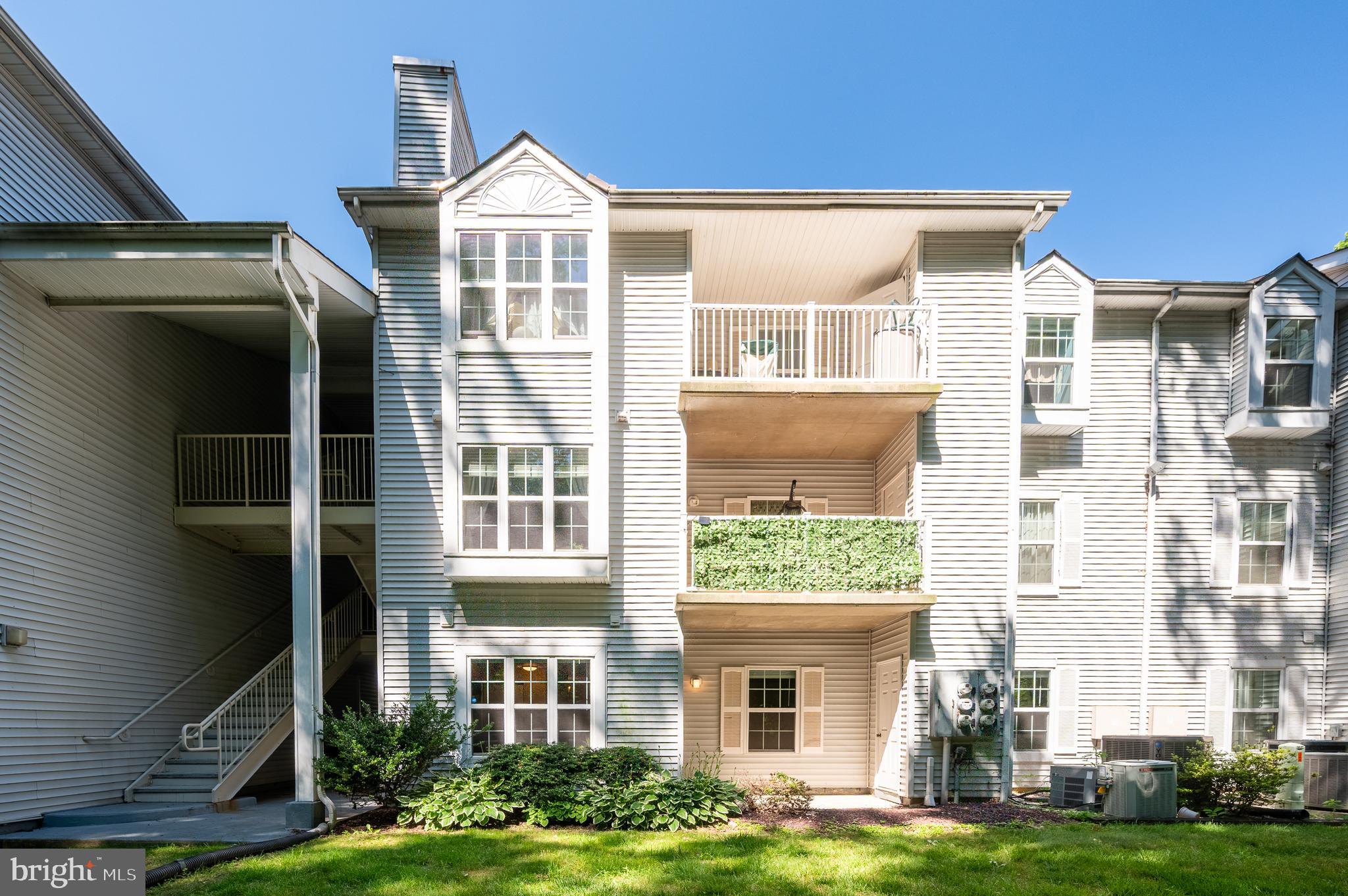 Welcome to Ashton Condominiums! Come visit this beautifully maintained 2-bedroom, 2-bath ground-level condo that offers the perfect blend of comfort and convenience. Ground-level living makes coming and going a breeze with convenient, stair-free access. Step inside to discover brand-new carpet throughout, creating a fresh, inviting atmosphere. The spacious living room is filled with natural light and opens directly to a private back patio, where you can relax and unwind while taking in the serene, wooded backdrop—your own peaceful outdoor retreat. The dining area showcases a stylish accent wall that adds personality and visual appeal, along with a convenient pass-through to the kitchen, creating an open feel that's perfect for both everyday meals and entertaining. The functional kitchen offers classic oak cabinetry, electric cooking, generous counter space, and plenty of storage. The spacious primary suite features a walk-in closet and a private en-suite bath with a stall shower and generous vanity space. The second bedroom is conveniently located adjacent to the full hall bath, complete with a tub/shower combination, making it ideal for guests, family, or a home office. Enjoy low-maintenance living with a monthly condo fee that covers water, sewer, trash, snow removal, road and common area maintenance, parking, and a security gate. Residents also enjoy access to an outdoor pool and picnic area, making it easy to relax and enjoy the community. Schedule your private tour today and discover all this inviting home has to offer!