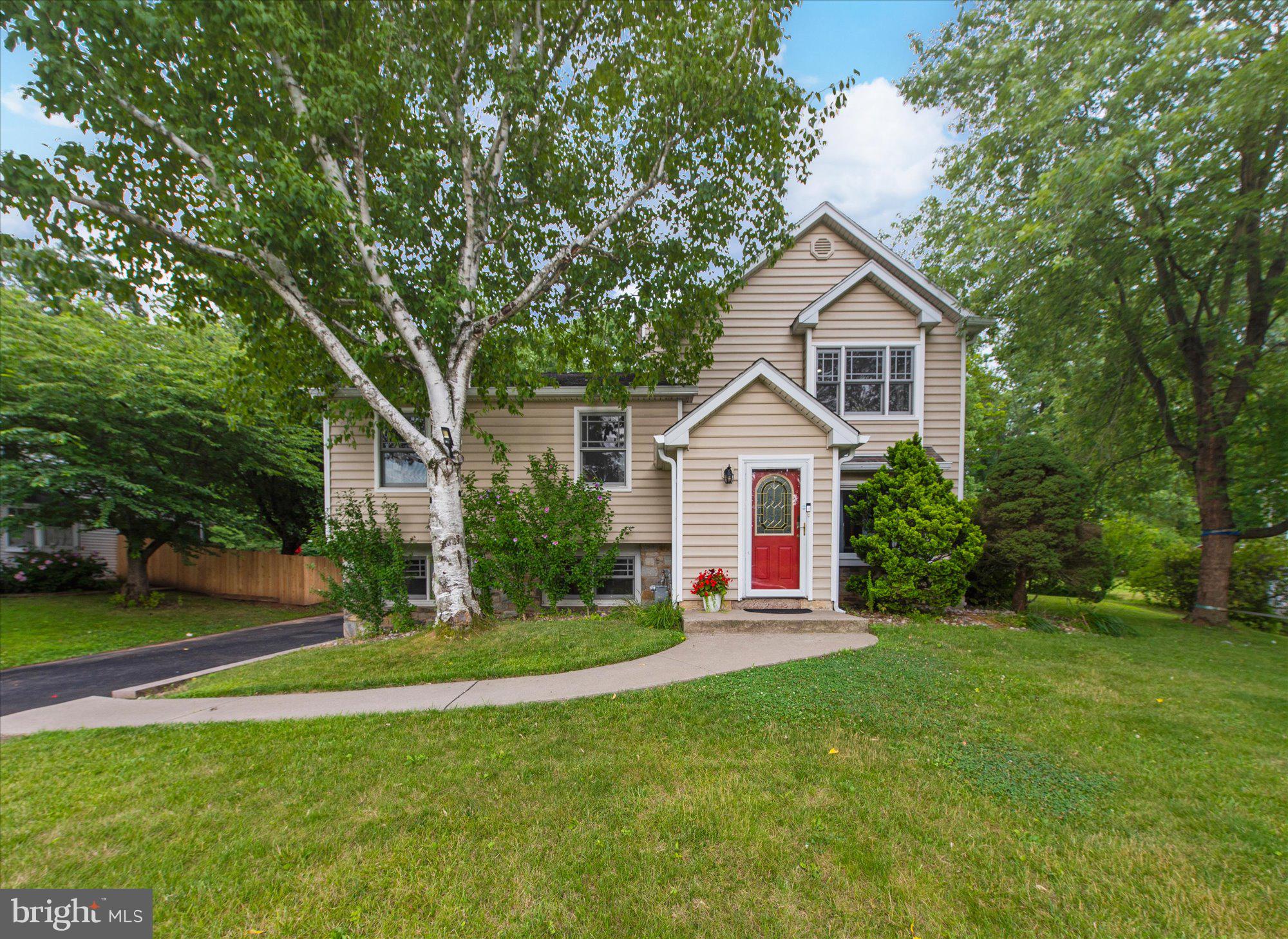 Welcome to this thoughtfully updated and expanded split-level home in the highly desirable Brittany Farms neighborhood, located within the Central Bucks School District. Offering 2,879 square feet of comfortable living space, this home features a bright, open layout with a carpet-free interior of gleaming hardwood and premium tile floors, all complemented by fresh, neutral paint and abundant natural light. A Nest thermostat and a whole-house A.O. Smith water conditioner with a Rhino tank(2021) add modern efficiency to everyday living.

As you step into the inviting foyer, the floor plan flows naturally into the living and dining rooms, offering clear sightlines to the outdoor spaces. The uniquely expanded layout—featuring a raised roofline, a spacious kitchen, and an additional bedroom over the garage—provides exceptional living space. The kitchen offers generous countertops, new stainless steel appliances (2024; including a refrigerator, dishwasher, and gas range), and a direct, scenic view of the backyard and pool area.

Unlike a traditional basement, the walk-out lower level sits above ground alongside the garage, which features a convenient EV charger (2024). Large windows bring in plenty of sunlight, creating a bright, integrated living area. This level includes a cozy fireplace, a custom wet bar, a half bath, and excellent storage space. Additionally, a French drain and two sump pumps were added in the crawl space (2024).

Upstairs, you will find four well-sized bedrooms, a dedicated laundry room with cabinetry and a utility sink, and a total of five bathrooms throughout the home for added convenience. The bathrooms have received recent cosmetic touches (2025) including new faucets, select lighting, mirrors, and a new toilet. The primary suite is a relaxing retreat, featuring a sitting area, walk-in closet, separate changing area, en-suite bath, and a private balcony. Another bedroom also enjoys its own private balcony overlooking the pool.

Outside, the expansive patio and in-ground pool offer a wonderful sense of privacy. The pool features a newly installed heater and dedicated electrical wiring (2024). Additionally, the driveway was newly paved (2025), and all gutters were replaced (2022) to enhance the exterior appeal. This meticulously cared-for home also features a furnace(2021).

Perfect for families, this home offers a premier location within the highly acclaimed Central Bucks School District. The top-rated Simon Butler Elementary School is just a 0.3-mile stroll away, making a short walk to school a daily reality. For older students, Unami Middle School is a brief 6-minute drive, and Central Bucks High School South is just 11 minutes away, ensuring effortless drop-offs.

This exceptional, move-in-ready home will not last long on the market. Schedule your private tour today!