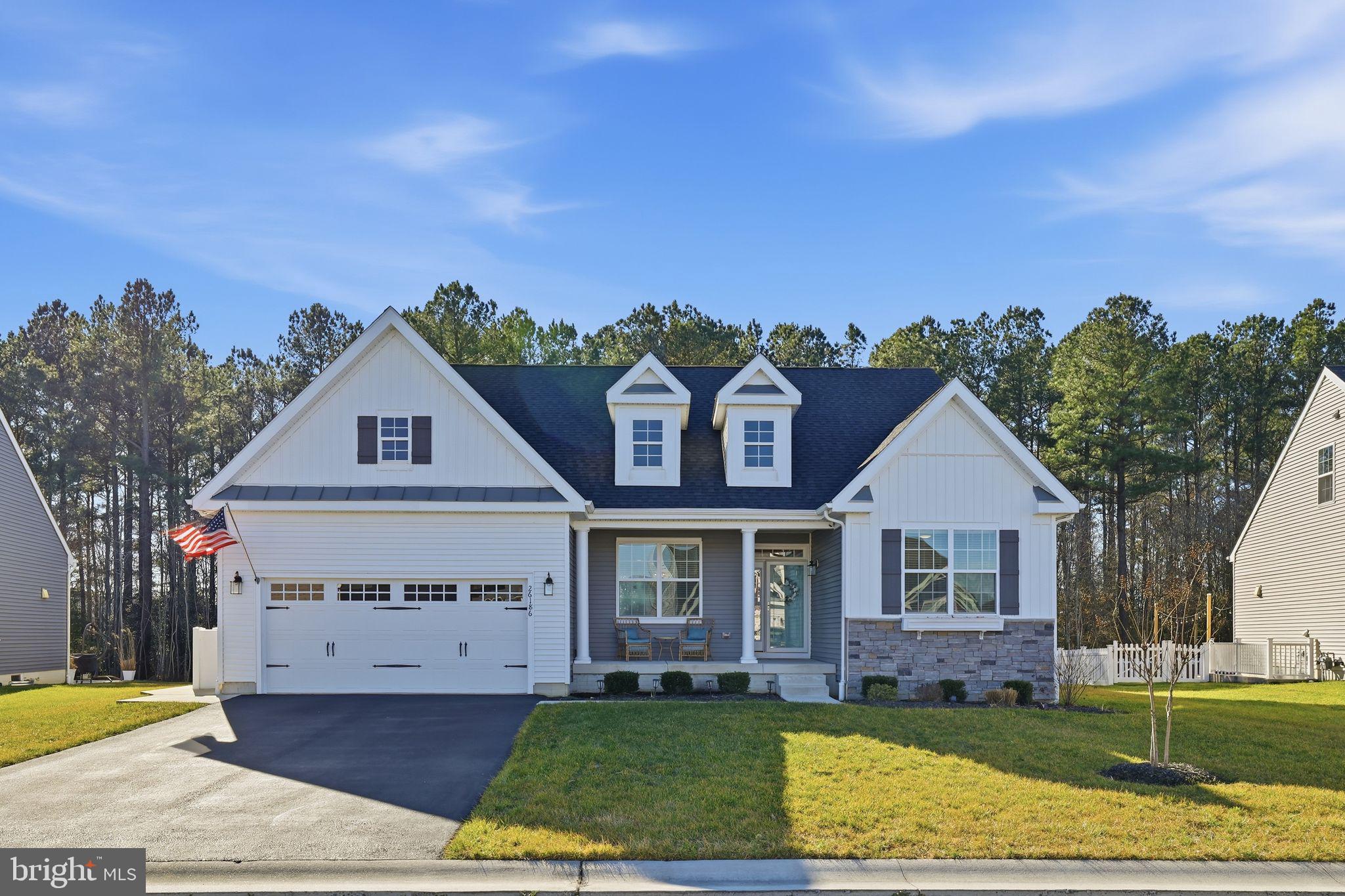 Located in the desirable Liberty community of Millsboro, DE, this beautiful 3-bedroom, 2-bath Fernmoor custom built home offers the perfect blend of comfort, space, and functionality. Complete with a 2-car attached garage and a welcoming covered front porch with peaceful pond views right out front. Step inside to find a formal dining room just off the entryway, ideal for hosting family dinners or entertaining guests. The home opens into a bright and spacious open-concept kitchen and living room, featuring a large living area with a cozy fireplace as the centerpiece. The kitchen is designed to impress with stainless steel appliances, a stylish tile backsplash, upgraded countertops, and a large island perfect for gathering. Just off the kitchen, you’ll love the walk-in pantry offering plenty of storage, along with a convenient utility room featuring a sink and shelving for added organization. A sliding glass door leads you out to the screened-in porch—an ideal spot to relax and enjoy the outdoors. The primary suite is privately located off the living room and features a spacious en-suite bath with dual sink vanity and a walk-in tile shower. Two additional bedrooms share a full bathroom, offering plenty of room for guests, family, or a home office. Downstairs, the finished basement provides even more living space—perfect for a man cave, movie room, game room, or entertaining area. There’s also a potential 4th bedroom or flex room option, plus an unfinished section that offers abundant storage space. Step outside and enjoy plenty of privacy in the backyard, beautifully lined with mature pine trees for a peaceful, secluded setting. This home truly has it all—schedule your showing today!