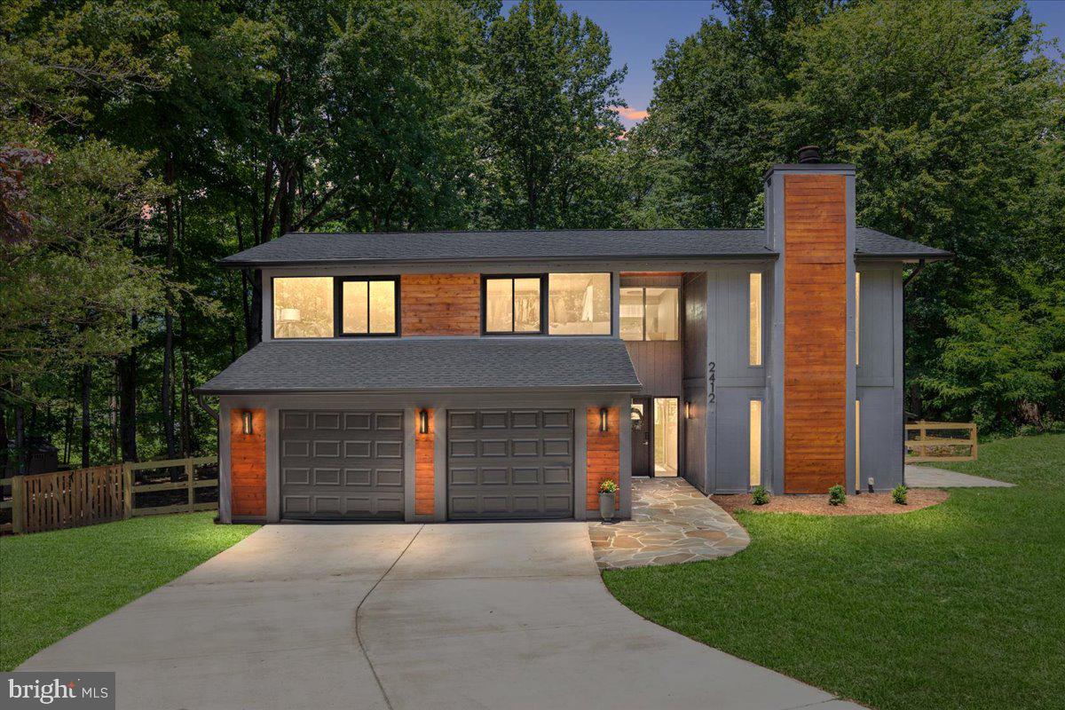 Some homes are updated. This one was completely transformed. 2412 Andorra Place is the kind of home that stops you the moment you walk in — every finish luxurious, every detail deliberate, every space designed with both beauty and function in mind. The sellers spared absolutely nothing, and it shows.
The foyer makes an immediate impression — open and inviting, with sightlines straight through to the kitchen, the sun-filled office, and the living room. Just off the entry, a spacious laundry room adds everyday practicality. The renovated powder room is its own moment — beautifully tiled with refined fixtures that feel far more luxury spa than anything you would expect at this price point.
The main living area is genuinely breathtaking. Solid bamboo floors, a wood-burning fireplace, and sliding glass doors that open directly to the stunning Pennsylvania flagstone patio create a space that is equal parts sophisticated and deeply comfortable. With mature trees framing every window and lush greenery visible from nearly every angle, the home carries the warmth and tranquility of a private wooded retreat — the kind of place that feels like a beautifully designed cabin in the woods, except it happens to be completely turnkey, impeccably finished, and move-in ready in every sense of the word.
The expanded kitchen is a showstopper. Fabuwood Galaxy cabinetry in Frost and Horizon finishes with soft-close doors, Top Knobs hardware set the tone. Calacatta Montage Quartz countertops and a matching backsplash run seamlessly across the kitchen and the extended cabinetry on the opposite wall, with the dining table anchored naturally in between. The oversized island — seating three — sits beneath skylights that pour natural light into the space throughout the day. Samsung Bespoke series appliances complete a kitchen that is truly as beautiful as it is functional. Just off the kitchen, a sun-filled flex room with a large window overlooking the backyard serves perfectly as a home office, reading nook, or playroom. Sliding glass doors off the kitchen lead directly to the Trex deck and the fully fenced backyard.
All three bedrooms are on the upper level. The primary suite is genuinely exceptional — easily accommodating a king-sized bed, with a fully custom Preston Collection closet system installed in 2026. The en-suite bath has been completely transformed with a soaking tub, a large walk-in shower with stone tile and glass door, brushed gold fixtures, double vanity, and dedicated linen storage — an indulgent, spa-like retreat.
The lower level is one expansive open space with a cozy LED fireplace — ideal as a rec room, media room, or home gym, with serious storage potential.
The mechanical updates are impressive, with warranties that convey: new ProVia windows (2022), new roof with lifetime warranty (2022), new HVAC and furnace (2025), new water heater (2022), and new garage door (2024). Samsung Bespoke appliances (2022), washer and dryer, bamboo flooring, and updated light fixtures throughout. Two-car insulated garage and new fiberglass front door.
The irregular Pennsylvania flagstone walkway and patio are nothing short of stunning. The all-wood exterior with real cedar accents adds richness and curb appeal that stands out on the street. The backyard is fully fenced with no road noise — a Trex deck, covered firewood storage, and shed make it as functional as it is beautiful.
A cul-de-sac street where neighbors know each other, kids play outside, and community is real — book club, whiskey club, neighborhood events, and an active group chat. Bus stop nearby. Reston is one of Northern Virginia's fastest-growing corridors — with RTC Next approved and Wiehle Metro steps away, values here continue to climb. Reston Association amenities include pools, lakes, trails, tennis and pickleball. Minutes to Reston Town Center, Whole Foods, and Trader Joe's.
A home this rare, on a street this special, simply does not come along often.