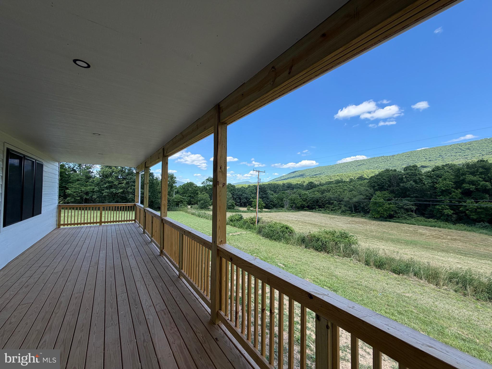 *Professional photos coming soon!*

Your chance to own a brand-new home with million-dollar views—without the million-dollar price tag! This beautifully designed 4BD/2BA new construction home is nearly complete and offers the perfect blend of quality craftsmanship, modern finishes, and breathtaking scenery. Set in a peaceful location with sweeping mountain views, this property is the ideal escape while still offering all the comforts of a thoughtfully designed home. Step inside and imagine yourself in a bright, open living space featuring durable Pergo flooring and quality finishes throughout. The spacious kitchen is sure to be the centerpiece of the home, designed with timeless white shaker cabinetry, stunning Silestone quartz countertops, a beautiful butcher block island top, and brand-new GE appliances—perfect for gathering with family and friends or simply enjoying everyday life in style. The well-planned layout includes two large bathrooms, both featuring double sink vanities for added convenience and functionality. The primary bathroom will feel like your own private retreat, complete with a soaking tub designed for relaxation after a long day of hiking, exploring, or simply enjoying the peaceful mountain setting. Generous closet space throughout the home offers plenty of storage and practical everyday living. Built with durability and curb appeal in mind, the exterior will feature low-maintenance LP SmartSide siding and inviting covered porch spaces designed to maximize the stunning surroundings. Enjoy quiet mornings on the covered front or side entry porches, or take in the unforgettable sunsets from the huge covered back porch—an ideal place for entertaining or simply soaking in those spectacular views. With construction nearing completion, now is the perfect opportunity to secure a brand-new home and enjoy the excitement of being one of the very first to make memories here. Offering modern finishes, quality materials, and a setting that truly captures the beauty of West Virginia, this almost-finished home is shaping up to be something truly special.