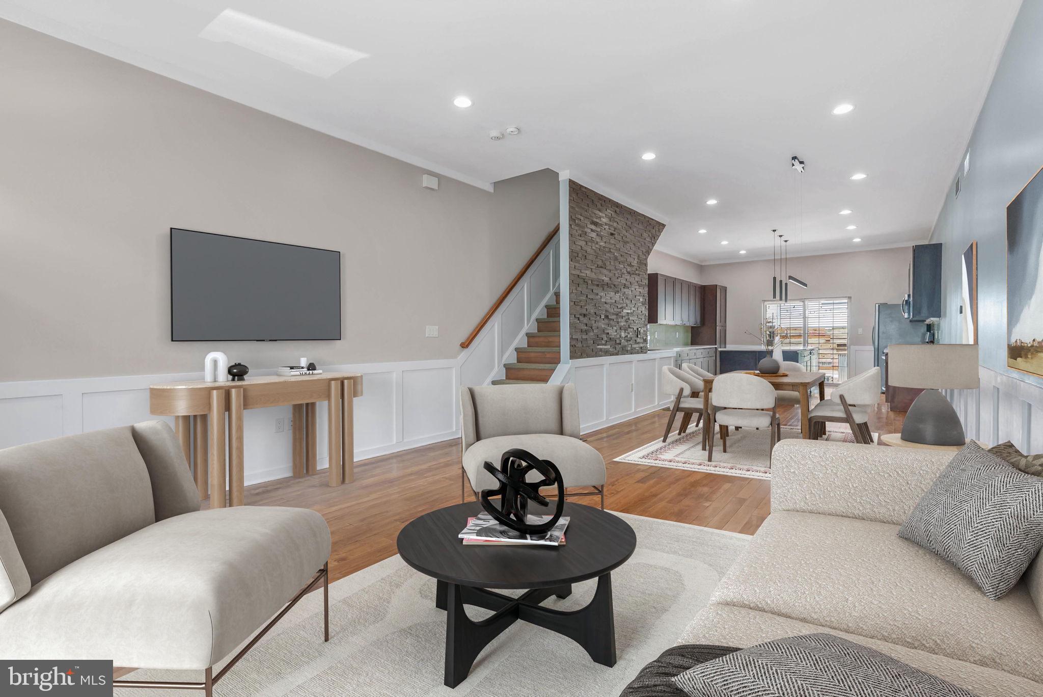 Welcome to one of Manayunk's most compelling opportunities—showcasing over 2,800 square feet of beautifully appointed living space across four expansive levels, this exceptional residence offers three generously sized upper-level bedrooms, two additional lower-level bedrooms, three full bathrooms, and the highly coveted convenience of two-car off-street parking.
Perfectly positioned on a quiet residential street, this home combines privacy with unmatched accessibility. It’s ideal location places you just moments from Main Street's vibrant restaurants, cafés, boutiques, and nightlife, while also providing easy access to the Manayunk Bridge Trail connecting to Bala Cynwyd, the Schuylkill River Trail and Canal Towpath, and I-76 for a seamless commute to Center City and beyond. The Manayunk West SEPTA station is also just steps away, making regional travel effortless.
Situated on a generous 17' x 99' lot, the thoughtfully designed floor plan is ideal for both everyday living and entertaining. The main level features soaring 9-foot ceilings, rich hardwood flooring, custom board and batten trim, and a striking wood accent wall that adds warmth and architectural character to the space. The expansive living and dining area flows seamlessly into a chef-inspired kitchen. Outfitted with extensive quartz countertops, custom maple cabinetry, and stainless-steel appliances, the kitchen offers both style and functionality. Sliding glass doors open to a spacious rear patio, creating the perfect setting for outdoor dining, gatherings, or a private urban retreat.
The upper levels provide exceptional flexibility with three generously sized bedrooms and two full bathrooms, including an impressive primary suite occupying its own private level. The retreat features a large walk-in closet, a spa-inspired en-suite bath with double vanity and oversized glass-enclosed shower, and direct access to a private fiberglass balcony. For buyers seeking even more outdoor living space, the balcony offers the potential for a future rooftop deck with sweeping neighborhood views.
The fully finished lower level offers exceptional versatility, featuring two additional bedrooms and a full bathroom, making it ideal for guests, a home office, fitness area, media room, or extended living accommodations.
Combining generous square footage, modern finishes, flexible living space, outdoor amenities, two-car parking, and an unbeatable location in the heart of Manayunk, this exceptional residence presents a rare opportunity to enjoy the very best of urban convenience and neighborhood charm.