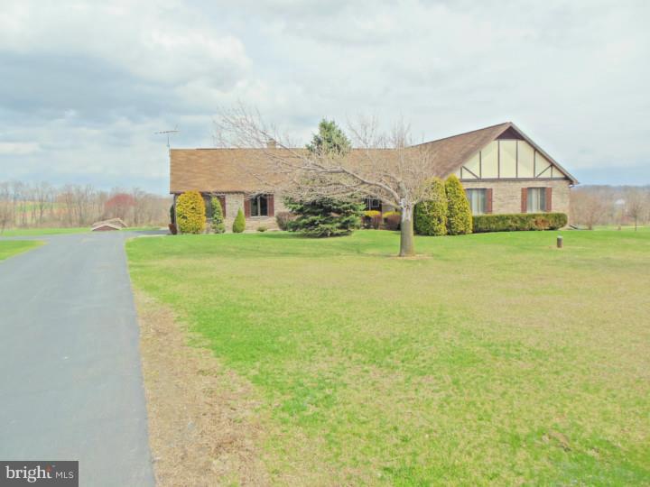 Great opportunity to own this spacious Ranch style home with a full walkout basement area. The home features 4 large bedrooms all with lots of closet and storage space. There are 2 1/2 baths in the home one located in the master bedroom suite. The full kitchen opens up to a bright family room with stone fireplace great for entertaining or just relaxing. The home is situated on 7.44 of beautiful scenic land that could be used for horses or farming. The property does have a small horse stall and shed for storing gardening equipment. The land is rolling with beautiful scenic views from the deck or patio of the property. Great opportunity to own a GEM!