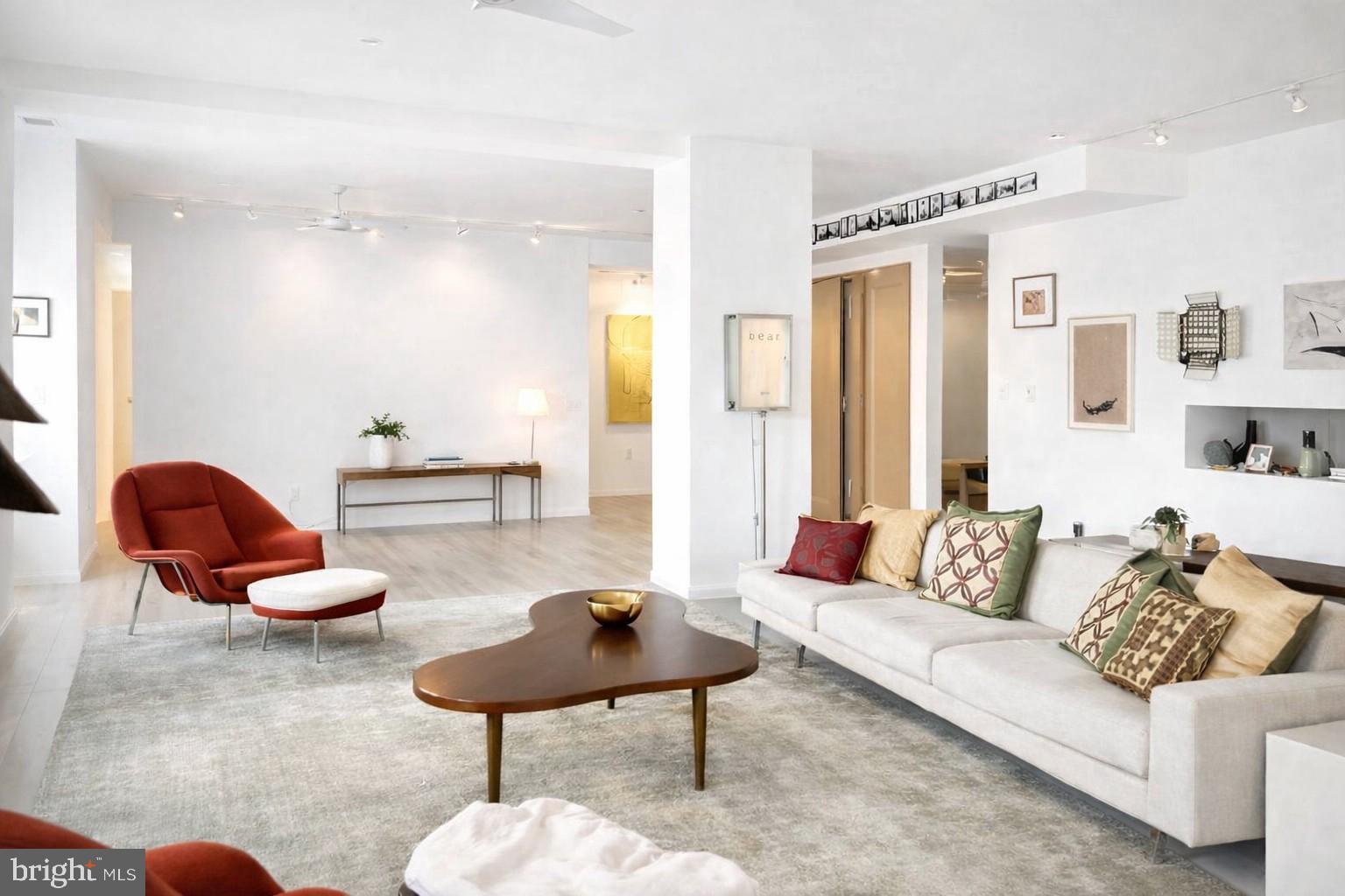 Here’s your opportunity to own a loft-style condo that has been beautifully reimagined by the owner. This expansive residence features 2 bedrooms, a den, an office, and 2.5 baths, offering unparalleled views of the Benjamin Franklin Parkway — all within one of the city’s most iconic historic buildings.

Upon entering, you’ll be greeted by crisp, airy contemporary finishes, including refinished Blanc hardwood floors that flow throughout the open layout. The chef’s kitchen boasts sleek slate countertops and modern appliances, perfect for both everyday living and entertaining.
Just off the entryway is a private office, ideal for working from home. The primary suite features sweeping Parkway views, a luxurious custom bath with custom steam shower and soaking tub, and a custom walk-in closet. The second bedroom also offers beautiful views, abundant natural light, and its own en-suite bath with a walk-in shower.
A versatile den provides the perfect space for a media or TV room, and there’s a convenient half bath off the hallway. Storage will never be an issue, with an additional room available for flexible use.
This truly one-of-a-kind home blends historic charm with modern design and will not last long!
