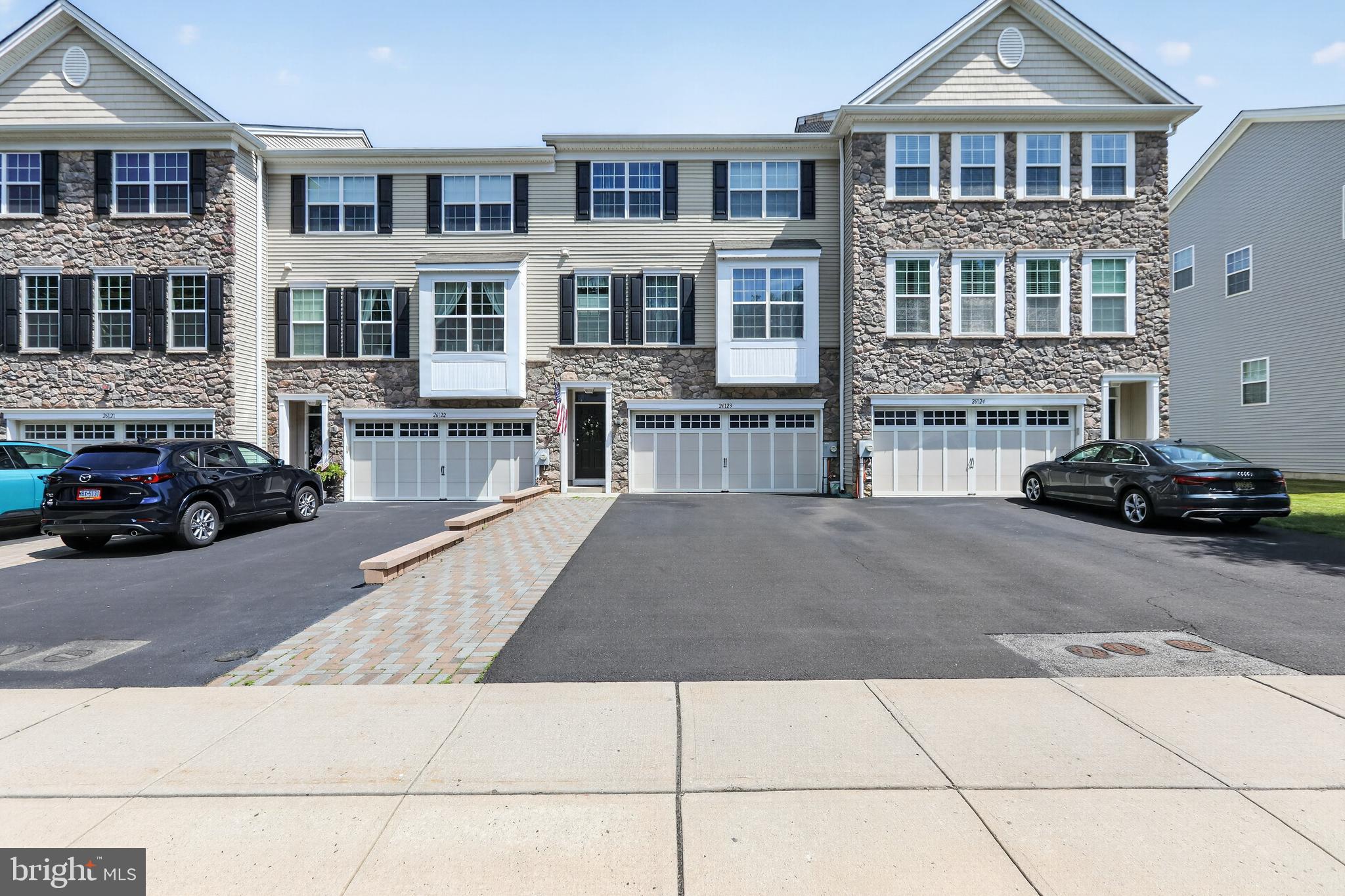 WOW! Stunning home in the highly desirable Big Oak Crossing community in Langhorne, located in the sought-after Neshaminy School District. Built in 2015, this beautifully FULLY upgraded home features a gourmet kitchen with 42" cabinets, granite countertops, stainless steel appliances, gas cooktop, double wall ovens, oversized island, and pantry. The spacious dining area includes a rare built-in double desk workspace and opens to a private elevated deck. The upper level offers a luxurious primary suite with tray ceiling, walk-in closet, and en-suite bath, plus two additional bedrooms, an upgraded hall bath, and convenient second-floor laundry. The lower level features a versatile bonus room, upgraded powder room, and sliding doors to a private paver patio. Conveniently located just minutes from I-95, Route 1, and the Turnpike, with shopping, dining, and everyday conveniences nearby. Move right in and enjoy!