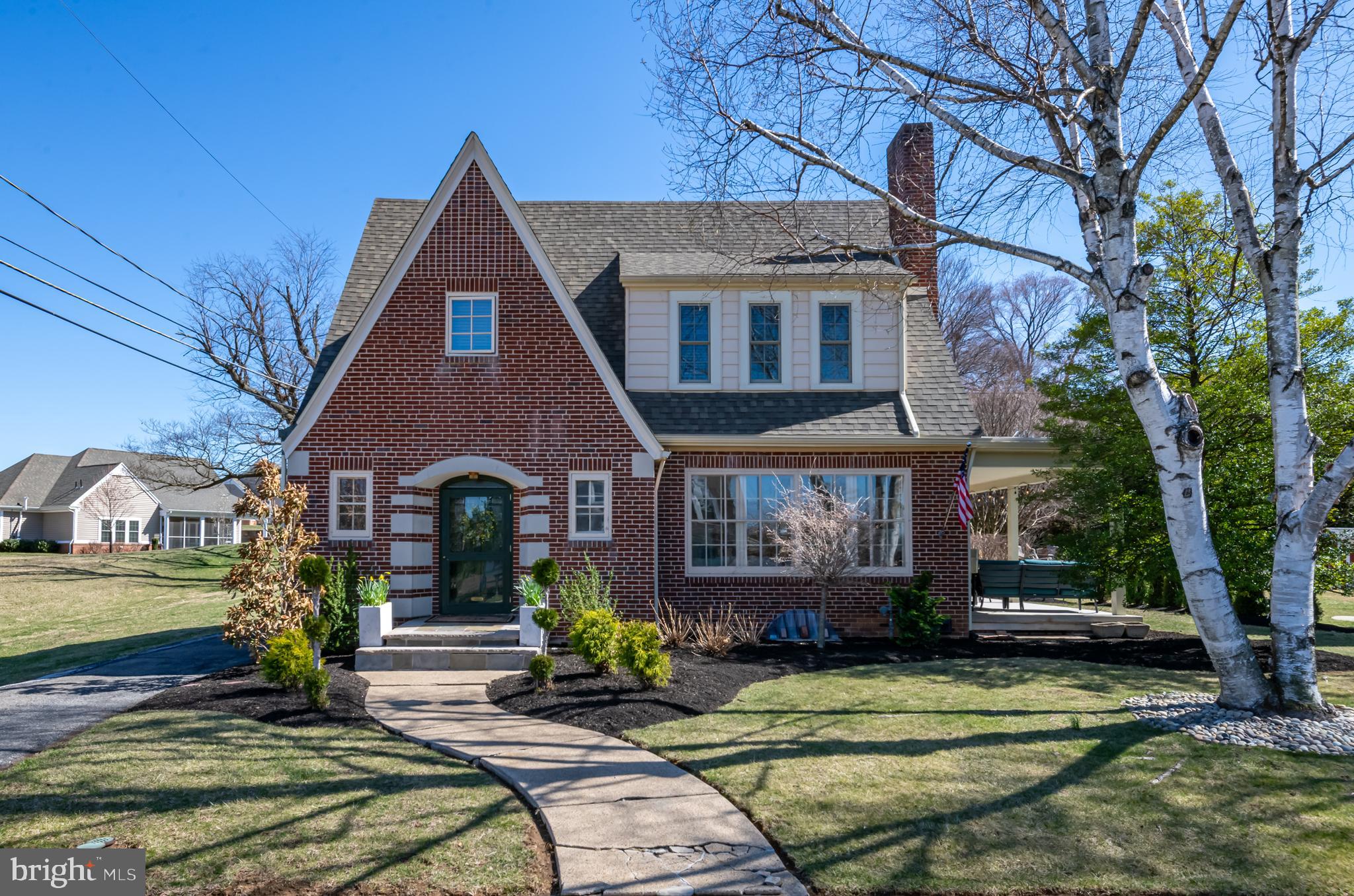 Multiple OFFERS have been received.  Highest and Best Sunday 3/30 at 8PM

Enjoy Tons of Charm and Character in this stunning Brick 2 story.  The First floor features beautiful hardwood floors and the large sundrenched living room includes a brick fireplace and pretty accent windows.  The adjoining Dining Room is spacious and has French doors leading to a large covered side porch, perfect for morning coffee or evening gatherings.  The New Custom Kitchen is spectacular, with an  oversized granite island that includes tons of banquette seating.  There is Gorgeous Tile flooring, and backsplash, and new stainless appliances including a beverage refrigerator.  An original Tile half bath is located just inside the entry.  Upstairs are three nice size bedrooms.  There is a walk-in closet in the hall and the Bathroom upgrades are spectacular with Custom double white vanity with stone top, woodworking, lighting and tile work.  The ceiling is vaulted with a Skylight too!  The lower level is clean and arranged into a family room, laundry area and workout space.  The landscaping is beautiful and the 2 car garage is close by and an outdoor seating area is ready for evening fires in the firepit.   This combination of Character and Modern upgrades is hard to find!