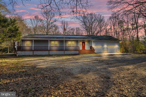 Newly remodeled house!!! Discover your own slice of paradise with this enchanting 6-bedroom ranch, nestled on over 8 acres of nature's splendor. As you step through the doors, you'll be enveloped in a world where rustic elegance meets the quintessential country lifestyle that you've always dreamed of.

 The heart of the home is a charming country kitchen, complete with stainless steel appliances and an inviting island that beckons your culinary creativity. The formal dining room is the perfect blend of elegance and comfort, setting the stage for gatherings that turn into cherished memories.

Relax and unwind in the cozy living room, where the warm embrace of the fireplace awaits. Venture downstairs to the fully finished lower level, hosting a spacious family room and two additional bedrooms, all freshly adorned with new paint, carpet, and refinished hardwood floors. The practicalities are taken care of too, with a new well pump installed in 2023 for your peace of mind.

Step outside onto the front porch and let the breathtaking views of the expansive yard wash over you. The oversized 2-car garage and additional storage shed ensure your space needs are met with ease. The outdoor living is just as impressive, with a patio and deck area that's simply perfect for entertaining or enjoying the serene landscaping in your peaceful retreat.

SITUATED ON OVER 3 ACRES, JUST MINUTES FROM ROUTE 5! Easy commute to DC, JBA, Pentagon, Alexandria, Arlington, Indian Head, and National Harbor. Close to shopping, dining, parks, and entertainment.