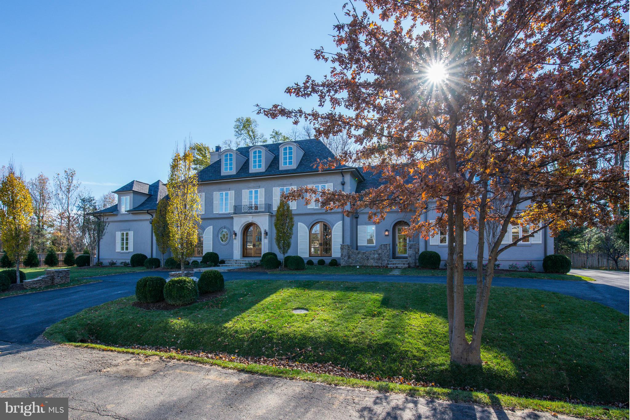 Stunning luxury home built w/the finest craftsmanship & attention to detail. Over 11k sqft of exquisite & open spaces-a true masterpiece w/timeless appeal. Chef's KIT w/marble, hardwoods thruout,10ft+ ceilings upper/lower, all marble baths, separate pool house w/kitchenette/BA/upper loft. Sited beautifully on huge, flat, private lot w/room for full size pool & extensive outdoor entertaining.