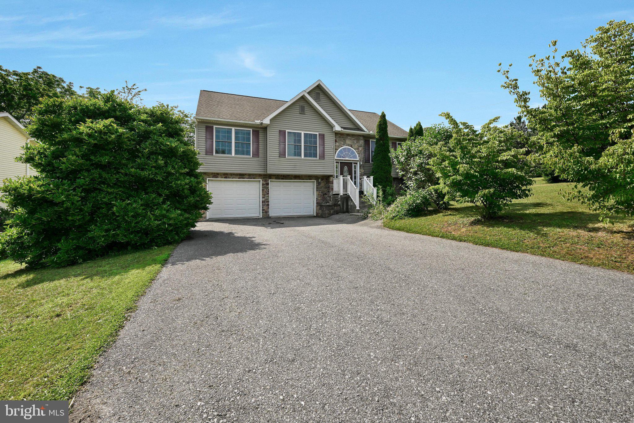 Experience the perfect blend of comfort and community in this beautiful, move-in ready 3-bedroom, 2.5-bathroom bi-level home, built in 2007. Situated on a desirable corner lot, this home boasts a spacious yard, a convenient large storage shed, and a two-car garage with electric openers. The interior welcomes you with a light-filled open floor plan, featuring LVP flooring and freshly updated neutral paint tones throughout. The primary suite serves as a relaxing retreat, complete with a private en suite bathroom and a large walk-in closet. The lower level offers a versatile and functional family room, perfect for relaxing or entertaining. Designed for ease of living, the home includes an efficient heat pump, central air, and a water heater replaced in 2021 for your peace of mind. Lake Wynonah is a premier, gated community that feels like a permanent vacation. Enjoy two pristine freshwater lakes and a wealth of amenities including a lodge with dining and a bar, an outdoor pool, pickleball and tennis courts, a marina, and scenic hiking trail. The community is vibrant and active, offering everything from social clubs and concert events to volunteer programs and a dedicated Fish & Boat group. Please call the Lake Wynonah Business Office for the most current updates regarding the Lake Wynonah dam rehabilitation project and any potential future assessments. Ideally located an hour or less from Allentown, Harrisburg, Hershey, and Reading, and within easy reach of Philadelphia and surrounding suburbs, this home offers the perfect retreat from the everyday.