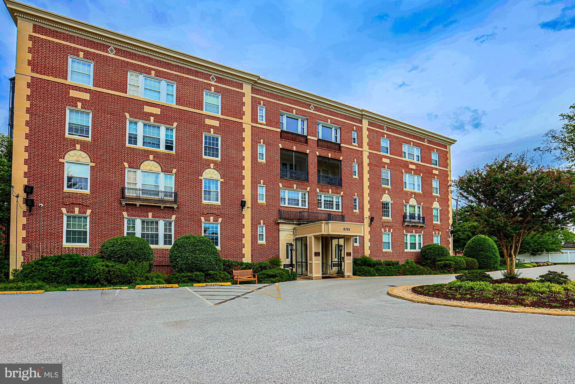 Bright and spacious condo in a luxury building offering over 2,200 square feet of elegant living space! A large foyer welcomes you into this beautifully maintained home featuring hardwood floors, high ceilings, and classic crown moldings throughout. The updated eat-in white kitchen includes all appliances, ceramic tile flooring, and plenty of room for casual dining. Enjoy entertaining in the formal dining room and expansive living room, which also offers the flexibility to convert into a 4th bedroom if desired. Relax year-round in the separate screened-in porch with tranquil views. The spacious primary suite features a dressing area and walk-in closet. Additional highlights include a new stackable washer and dryer and air conditioning replaced in 2025. A rare opportunity for luxury condo living with generous space, timeless details, and versatile layout options!