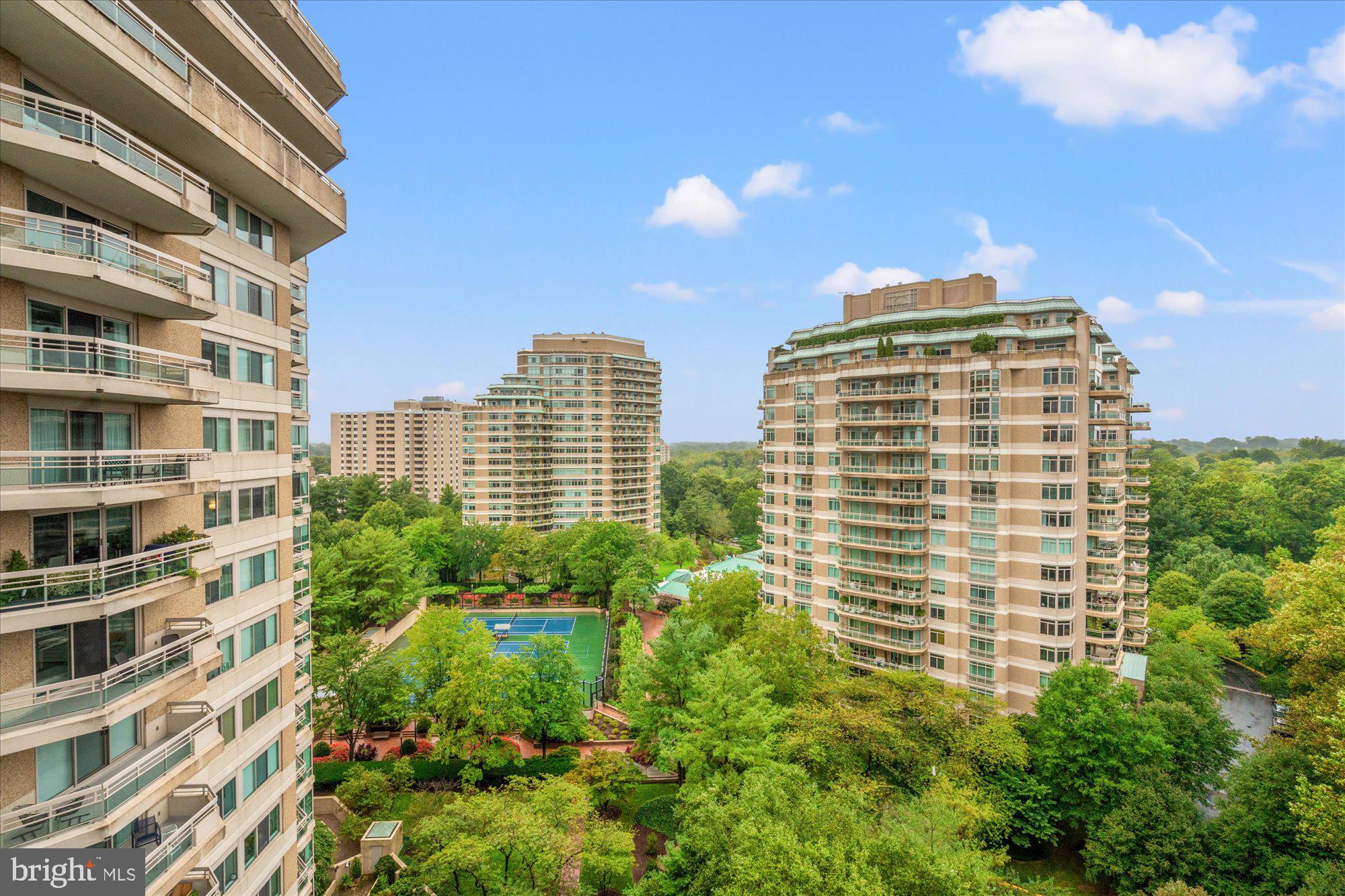 Welcome to this gorgeous, bright and very spacious condo at the resort-like Somerset House 1 Condominium. Close to 2800 sq ft of living space, 2-BR plus library, 2.5-BA, on a high floor, with two balconies and spectacular panoramic views.
Foyer entry with a powder room and an adjacent coat closet; very large eat-in kitchen with a custom-build moveable island, a pantry and a laundry closet. The light-filled corner living room has a pantry-bar and opens to the adjacent dining room with an electric fireplace.  Full-size library with beautiful wooden built-ins. The two bedrooms are at opposite ends of the unit. The large primary bedroom suite features its own balcony, two very generous walk-in closets with high-end shelving systems, and a luxury bathroom with marble floor, a jetted bathtub, and a separate walk-in shower. The second bedroom features a whole wall of built-in shelves and drawers.
The Somerset House is a luxury, gated community with guarded entrance, 24-hour security, and an abundance of amenities (doorman/valet; clubhouse; conference room; card room; arts and crafts room; party rooms; indoor and outdoor pools; fitness center with sauna and massage; aerobic studio; indoor racquetball, basketball and pickleball court; three tennis courts; ping-pong room; and beautifully landscaped, lush grounds with walking/jogging paths).  
Two indoor garage spaces (G2-103 & G2-104),  adjacent to the elevators, are deeded with the property, and so is a storage unit (G2-50). 
This exceptional home is ideally located, steps away from grocery stores, luxury shops and fine dining, as well as the Friendship Heights metro and bus station.