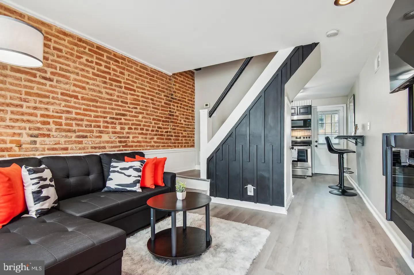 Discover an exceptional investment opportunity in the heart of the Federal Hill Historic District! This beautifully renovated end-of-row townhouse, completed in 2023, boasts modern elegance while preserving its classic Federal architectural charm. With 624 sq. ft. of thoughtfully designed living space, this property features a spacious bedroom and a full bathroom, making it ideal for urban living. The kitchen is a chef's dream, equipped with high-quality appliances including a cooktop, dishwasher, microwave, and convenient in-unit washer and dryer. The combination of ceramic tile and hardwood flooring adds a touch of sophistication, while exterior security cameras provide peace of mind for residents. Located just minutes from the airport and surrounded by vibrant urban amenities, this property offers unparalleled access to dining, shopping, and entertainment. The on-street parking with included permits enhances convenience for both residents and guests. Investors will appreciate the potential for strong rental returns in this sought-after neighborhood, known for its rich history and community spirit. With the recent renovations, this property is move-in ready, minimizing initial costs and maximizing cash flow. Seize the chance to own a piece of this thriving urban landscape, where historic charm meets modern living. This property is not just a home; it's a smart investment in a flourishing market. Don't miss out on this rare opportunity!