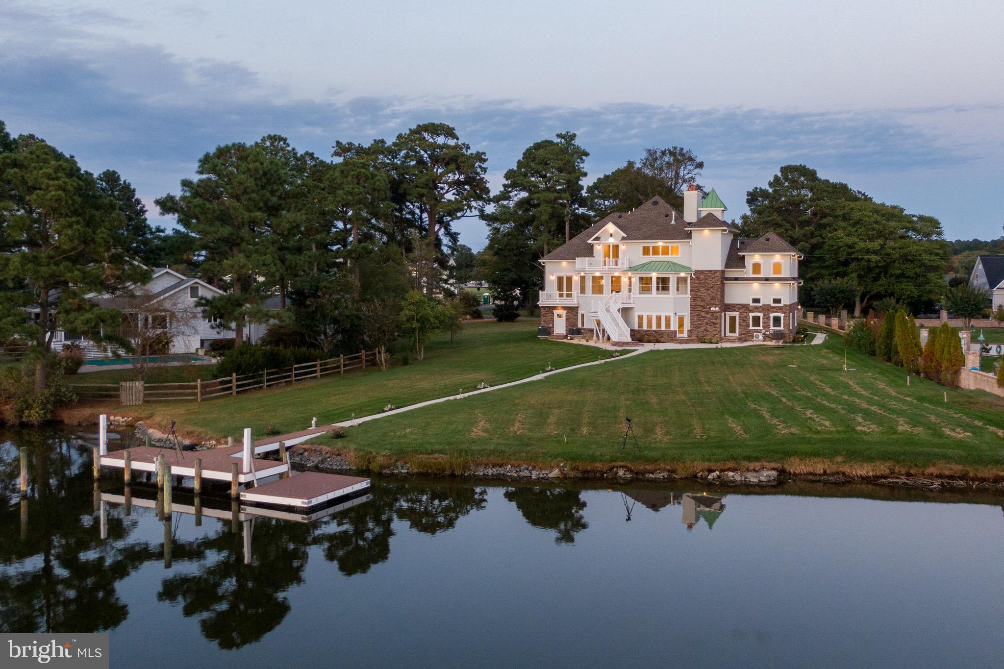 6920 Hall Drive: Absolute stunning new construction located on the Direct Bayfront on our most prestigious neighborhood of South Point. Exclusive Private Boat Dock with water and electric already run. Multiple wood burning fireplaces. 4 full size bedrooms, 5 full baths, 2 half baths. Incredible stone front. Slate stairway leading to your mahogany double door entrance. 2 car fully insulated garage with exercise room that has its own heating and air unit. Multiple zone heating and air system, Trex decking, amazing kitchen with every upgrade you can imagine including counter, cabinets, wolf stove(to be installed) Amazing walk in closets. Lawn sprinkler system. Fully landscaped. Needless to say, if you are looking for new construction, bayfront, there are not too many homes that compare for the price. Call listing agent for all details. Also included in documents, survey and full scale layout of the homes design. Upgrades and superior construction must be seen to be appreciated.