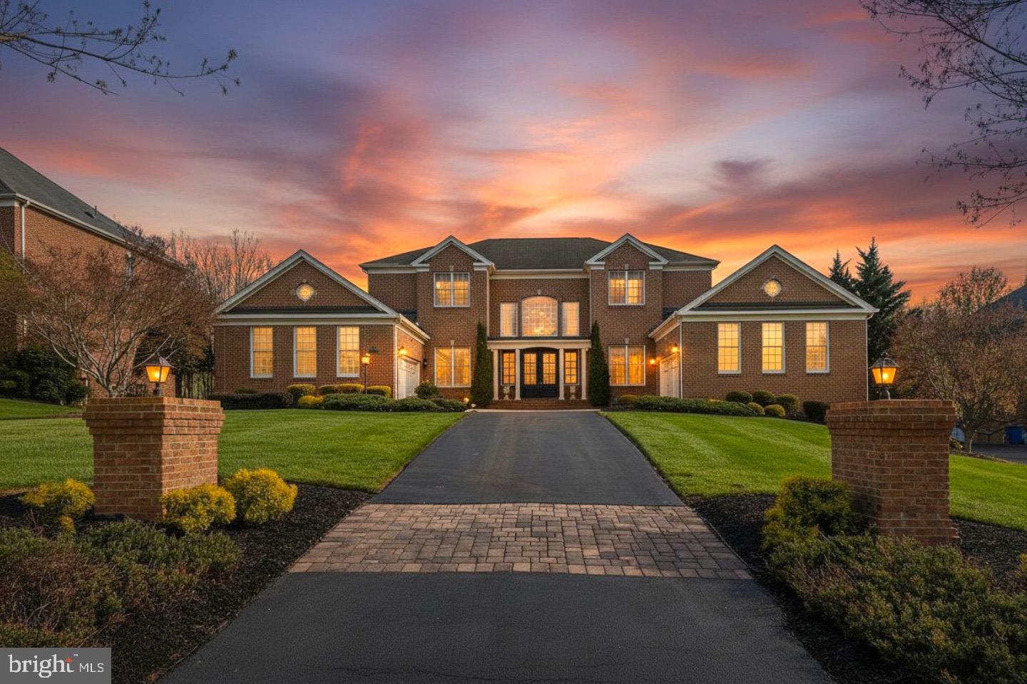 Extraordinary 10,000+ SF brick-front estate on a premium 1.03-acre cul-de-sac lot backing to protected woods in prestigious Patuxent Chase. This architectural masterpiece delivers six bedrooms, five full baths, and two half baths across three meticulously finished levels designed for grand-scale entertaining and refined daily living. A breathtaking two-story foyer with sweeping curved staircase opens to elegant formal living and dining rooms featuring detailed crown moldings, wainscoting, and expansive windows flooding the home with natural light. The gourmet kitchen is a chef's showcase—granite countertops, massive center island, custom cabinetry, gas cooktop, stainless steel appliances, and a sun-drenched breakfast conservatory flowing seamlessly into the dramatic family room with soaring ceilings and gas fireplace with custom mantel. A main-level bedroom suite, private study, and mud room with laundry complete the first floor. The palatial primary suite is a true retreat with a spacious sitting area, dual custom walk-in closets, and spa-inspired bath with soaking tub, frameless shower, and dual vanities. Four additional upper-level bedrooms offer generous proportions and designer baths. The fully finished walk-out lower level is an entertainer's paradise—recreation room, dedicated media lounge, game room, bonus rooms, full bath, and French door access to the rear grounds. Hardwood flooring, energy-efficient double-pane windows, 21 total rooms, and high-end finishes throughout. Side-entry 4-car attached garage. Serene tree-lined views from every vantage point. Howard County schools. Minutes to Routes 29, 32, and I-95 for effortless commuting to Baltimore and Washington, D.C. A rare opportunity at this price point—this is estate living at its finest.

Situated on over an acre, the beautifully landscaped lot provides privacy and space for outdoor enjoyment. Additional highlights include a side-entry 4-car garage, hardwood flooring, multiple fireplaces, and high-end finishes throughout.
Coming Soon – Showings Begin 05/28/26
Don’t miss this rare opportunity to own a premier home in a prestigious location!