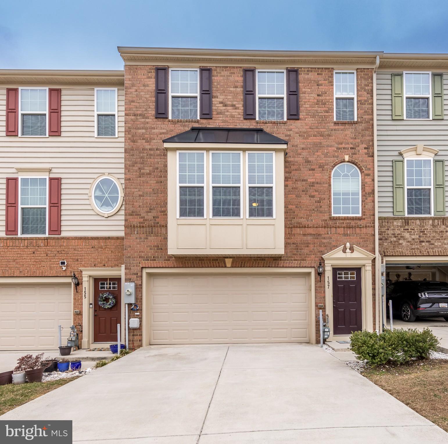 Price Adjusted!  Amazing three-bedroom town home in sought after Greenway Farms Community boasting rich hardwood floors, lofty sun-drenched windows, and designer details throughout. Seller has had home freshly painted and installed new carpet.  Kitchen boasts granite counters, stainless steel appliances, central vacuum, under counter lighting, and entertainer's island with breakfast bar seating. Host causal or formal dinners in the separate dining area with walk out access to the rear deck. Retreat to the owner's suite complete with tray ceiling and large walk-in closet. En-suite bath with soaking tub, double vanity, and separate shower. Upper level sleeping quarters with two additional bedrooms, full bath, and laundry. Finished lower-level recreation complete with walk out level to the fenced-in rear yard.  Front-loading two car garage plus additional driveway space makes parking easy and worry free.  Move in intime to enjoy Community Swimming Pool and tennis courts for this Summer.
