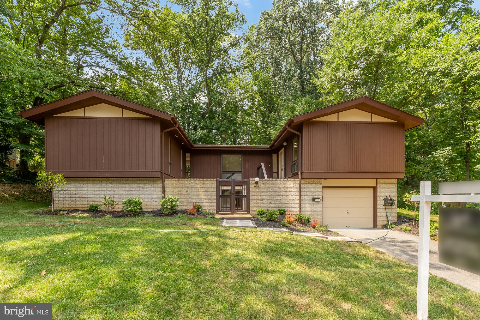 There is something special about a home that feels tucked away from it all while keeping everything within easy reach. Set on nearly half an acre and backing to mature trees in Annandale's beloved Truro neighborhood, this beautifully reimagined home offers the kind of privacy and tranquility that is increasingly hard to find.

Mornings begin with coffee overlooking a canopy of trees. Afternoons are spent enjoying a backyard that feels more like a private park than a suburban lot. Whether hosting friends on the newly built patio, gardening in the expansive yard, or simply enjoying the quiet surroundings, this is a home that invites you to slow down and stay awhile.

Inside, every space has been thoughtfully updated to support the way people live today. The completely redesigned kitchen serves as the heart of the home, featuring custom cabinetry that extends to the ceiling, quartz countertops, and an open layout that creates a natural flow between living, dining, and outdoor spaces. Beautiful new flooring carries throughout the main living areas, while the renovated bathrooms bring a sense of comfort and calm with timeless, spa-inspired finishes. A newer roof, replaced in 2019, adds peace of mind for years to come.

What truly sets this property apart is the land. The combination of a flat, usable lot and a backdrop of mature trees creates a setting that is both functional and private. There is room to entertain, play, garden, and gather, all while enjoying the feeling of being surrounded by nature.

Life in Truro extends beyond the property lines. Neighbors enjoy an active community with a pool, tennis and pickleball courts, basketball court, clubhouse, playgrounds, walking trails, and year-round events. The home is also zoned for highly regarded Wakefield Forest Elementary, Frost Middle School, and Woodson High School.

Just minutes from the Mosaic District, Tysons, Fairfax City, and major commuter routes, this home offers a rare combination of thoughtful updates, exceptional outdoor space, and a location that keeps you connected while feeling a world away.