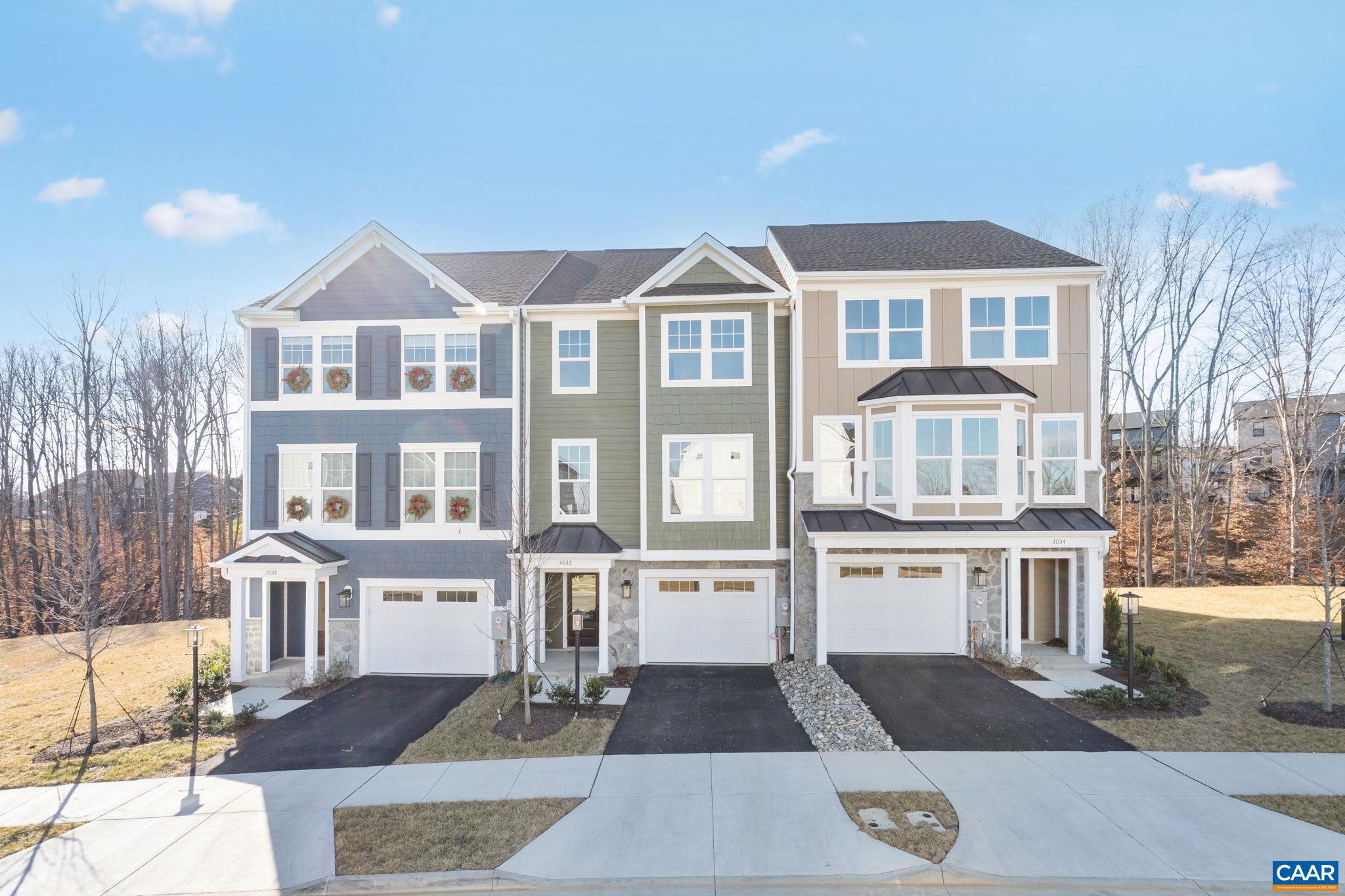 Meet the Holly I, a three-story new construction townhome located in the newest section of Belvedere. The main level includes a flexible rec room and half bath, which works well as a workspace, home gym, or extra hangout spot. Upstairs, the second floor opens up with a roomy kitchen that features a walk-in pantry, a comfortable dining area, and a bright family room. A screened-in porch just off the main living space makes it easy to enjoy the outdoors, and there is an additional half bath on this level as well. On the third floor, the primary suite includes its own private bathroom, while two more bedrooms share a full hall bath. The laundry closet is also upstairs for added convenience. Oak stairs with open railings add a nice finishing touch, and the one-car garage in front provides both parking and extra storage. Belvedere offers an array of amenities, including access to parks, close proximity to the Rivanna trailhead, the nearby SOCA Fieldhouse, a dedicated dog park for pet owners, and playground areas. Actual photos!,Granite Counter,Maple Cabinets,Painted Cabinets,White Cabinets,Wood Cabinets