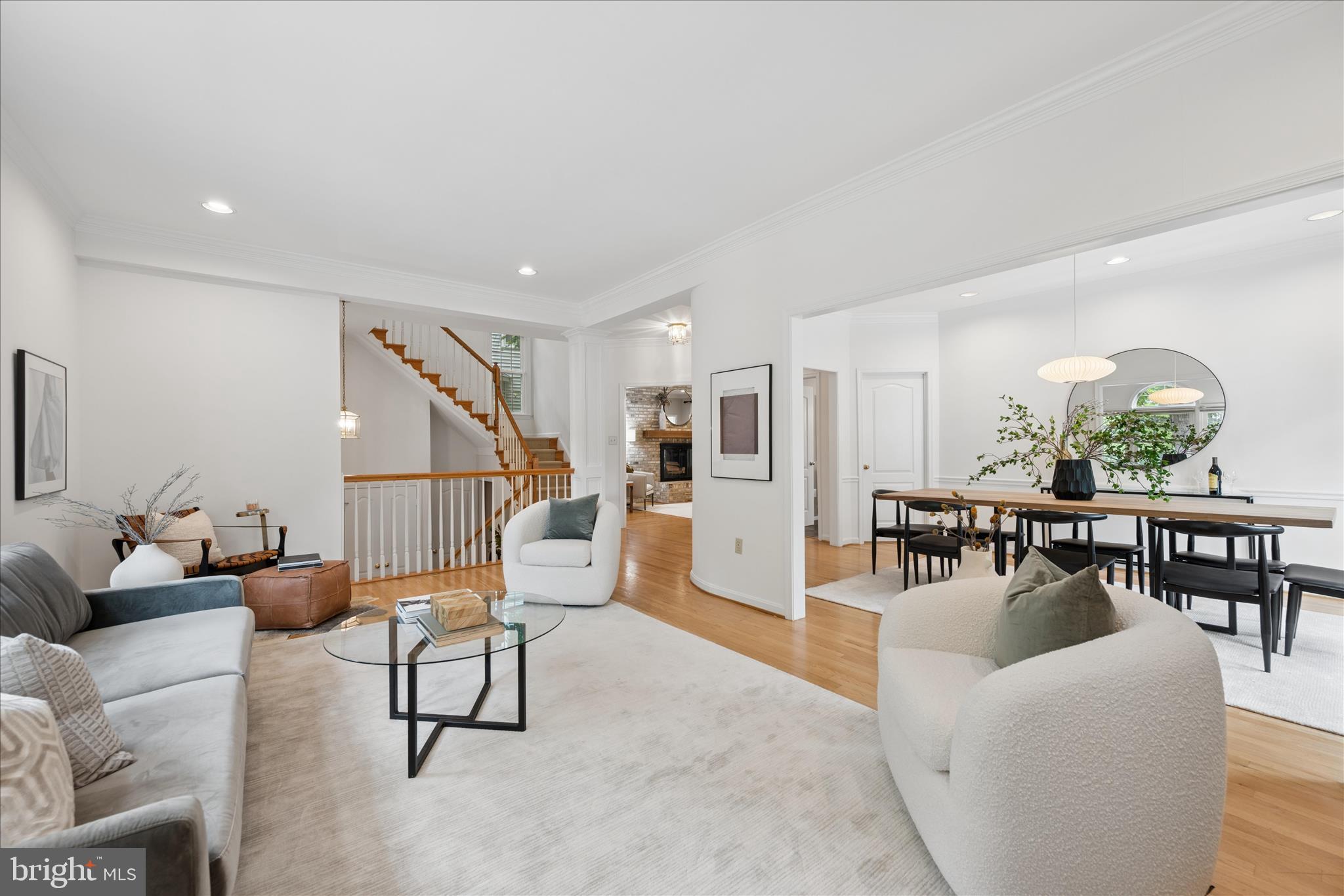 The three magic words of real estate are LOCATION, LOCATION, LOCATION and this magnificent home has it in spades! Perfectly perched on a beautiful home-site in popular WOODSIDE, this sundrenched beauty is filled with all of your favorite things! Outstanding features include a RARE sideloading THREE (3) car garage... (with 3 separate bays) ideal for the car enthusiast or hobbyist. A fabulous sunroom… designed by locally renowned Richard Crone… is accessed via French patio doors from the family room… and is a gorgeous spot to curl up with a good book and enjoy the sights and sounds of nature.  The floorplan is wonderful with a fabulous flexible circulating design. The elegant reception rooms, with nine foot ceilings, are ideal for entertaining on a large scale and hosting holiday dinners. Gleaming hardwood floors are featured throughout the main level and upper hallway with slate floors in the gourmet kitchen. The family room features a floor to ceiling French Boral brick, wood burning fireplace and a handsome wood mantle. All four upper level bedrooms have vaulted ceilings and include the primary, en-suite bedroom and three additional large bedrooms that utilize a second level full bathroom.  Completing the amenities on this upper level are a laundry room, linen closet and a vast upper level landing.  The lower level includes the aforementioned three side loading garages with direct access to a lower level rec room, entertainment room, office or playroom.  Plans have been imagined and are in place for a third, full bath on this level which can be completed prior to moving in. Recent improvements include; an architectural roof, maintenance free energy efficient windows, top-of-the line insulated garage doors, finished and painted garage, lower level ready to receive a full bathroom with plans and rough-in plumbing in place, fenced and private rear yard, professionally landscaping with beautiful shrubs and flowering trees. The rear patio is an oasis in the city and a wonderful perch from which to listen and watch a plethora of songbirds.  Freshly painted and in move-in condition, this is truly a home to delight any commuter, entertainer, gardener, fitness enthusiast and hobbyist … you simply will not find a better home in Woodside! 
 
This brick fronted beauty is mere steps away from the fun filled and fabulous, 3.6 acre, scenic Ellsworth Park! The park is teeming with amenities and includes a large and small breed dog park where your pooch can play off leash. Tennis courts, basketball courts, swing sets, slides, climbing equipment, shaded picnic areas, water fountains, bike racks and all sorts of exercise equipment will have you fit as a fiddle in no time!  After hours of play, you can walk to nearby Zinnia’s and grab coffee, lunch or dinner to enjoy the gardens while your waiter is on the way! Sligo Creek Park is also a short stroll and of course Woodside is home to beautiful gardens and mature tree lined streets.  Access to Metro and the future Purple Line is eight tenths of a mile away and the restaurants and businesses of downtown Silver Spring are even closer!   
 
8900 Ellsworth Court is a rare and wonderful combination of style, size, location, utility, and nature.  Don’t miss this opportunity to have it all.