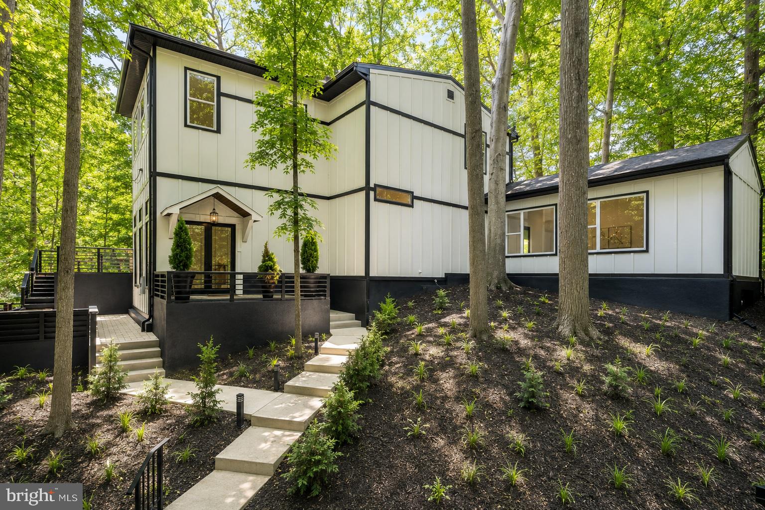 This home is a showstopper.

With 11-foot ceilings, walls of glass, and unobstructed views of Sligo Creek from nearly every room, this Colonial Modern feels more like a private retreat than a typical Takoma Park home. Perched on over half an acre above the creek, it offers a rare combination of privacy, natural beauty, and modern design.

The main level is built for both everyday living and entertaining, featuring a chef’s kitchen with a waterfall island, walk-in pantry, beverage bar, two bedrooms, and two full baths. Upstairs, the primary suite offers vaulted ceilings, a spacious dressing room (or sixth bedroom), and a spa-inspired bath, while two additional bedrooms provide plenty of space for family or guests.

Multiple decks and porches take full advantage of the setting, creating seamless indoor-outdoor living. A two-car garage with EV charger, expansive driveway, and spacious lower level add convenience and flexibility.

Just steps from the trails of Sligo Creek Park and minutes from Takoma Park favorites like Cielo Rojo and the Takoma Park Farmers Market, this is a truly special home in one of the area's most beloved neighborhoods.