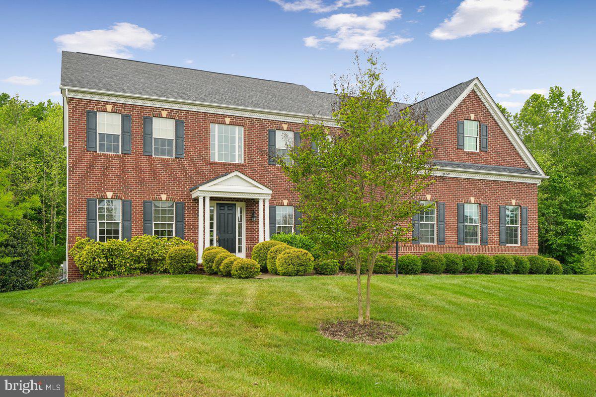 Why spend an insurmountable amount of money with add-ons for a new build home, when you can have a 5,000+ sqft, luxurious 5 bedroom 4.5 bathroom renovated estate, ready for your enjoyment; and at a fraction of the cost. Welcome to 14305 Dawn Whistle Way — a stunning estate tucked away on over an acre, on the absolute best lot in one of Bowie’s most desirable luxury communities. Built by Caruso Homes in 2016, this Monticello style home offers over 5,100 square feet of beautifully designed living space, blending timeless elegance with modern comfort, that create an atmosphere of comfort and sophistication throughout. From the moment you arrive, you’ll appreciate the home’s impressive curb appeal, spacious attached two car garage, and serene setting surrounded by mature greenery.

MAIN LEVEL FEATURES:    walk inside, where you will enjoy sun-filled interiors, generous living and entertaining spaces, and a thoughtfully designed layout ideal for both everyday living and special gatherings. The family room boasts a coffered ceiling with a row of 6 windows for uninterrupted view to your private acre woodland, perfect for you to enjoy nature. The main level also features a library with double glass doors, 10' ceilings and crown molding finishes throughout the majority of the main level. The gourmet kitchen features  huge island, plenty of counter space for cooking and an adjoining sitting area. 

UPPER LEVEL FEATURES:   Walk upstairs where you will find a enormously sized owners suite you will not believe!!! This primary suite takes your luxurious experience to another level, with key features that include-  a relaxing sitting area that boasts a gas fireplace, a walk in closet the size of a bedroom, an en-suite bathroom with a separate soaking tub and walk-thru shower platform. Upstairs you will also find a second bedroom with an en-suite bathroom and main hallway full bathroom. 

LOWER LEVEL FEATURES:   The finished lower level features a spacious bedroom, full bathroom, a recreation area, sitting area, and separate space for a home theater or gym. 
Situated on a private 1.1-acre lot, this home provides the perfect balance of peaceful suburban living with convenient access to major commuter routes, shopping, dining, a short drive to the Largo Metro Center, and everything the Bowie and Woodmore areas have to offer. A rare opportunity to own a distinguished property with space, privacy, and style, for a fraction of the price of a new build home this size and model, with all of these add on features.