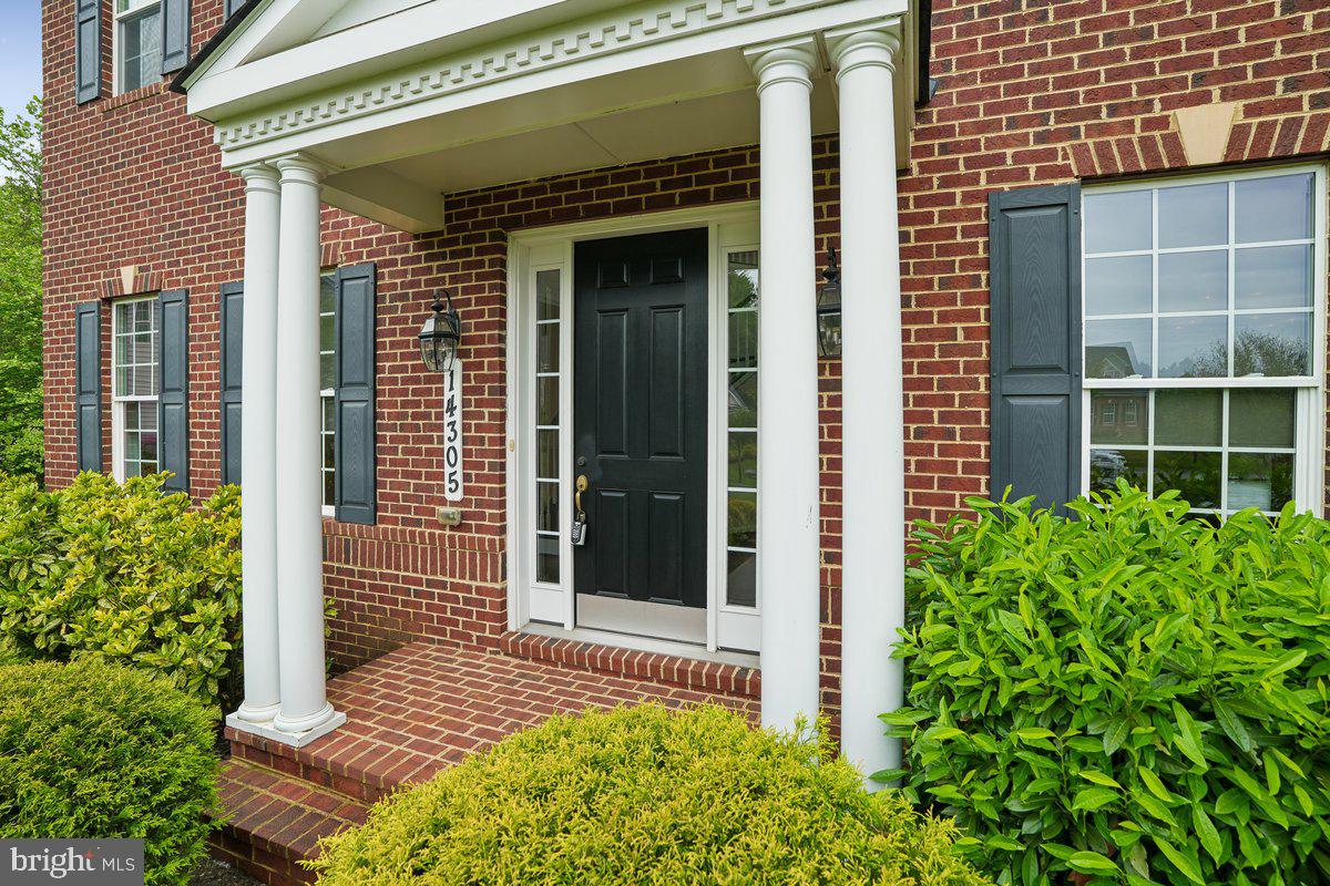 Why spend an insurmountable amount of money with add-ons for a new build home, when you can have a 5,000+ sqft, luxurious 5 bedroom 4.5 bathroom renovated estate, ready for your enjoyment; and at a fraction of the cost. Welcome to 14305 Dawn Whistle Way — a stunning estate tucked away on over an acre, on the absolute best lot in one of Bowie’s most desirable luxury communities. Built by Caruso Homes in 2016, this Monticello style home offers over 5,100 square feet of beautifully designed living space, blending timeless elegance with modern comfort, that create an atmosphere of comfort and sophistication throughout. From the moment you arrive, you’ll appreciate the home’s impressive curb appeal, spacious attached two car garage, and serene setting surrounded by mature greenery.

MAIN LEVEL FEATURES:    walk inside, where you will enjoy sun-filled interiors, generous living and entertaining spaces, and a thoughtfully designed layout ideal for both everyday living and special gatherings. The family room boasts a coffered ceiling with a row of 6 windows for uninterrupted view to your private acre woodland, perfect for you to enjoy nature. The main level also features a library with double glass doors, 10' ceilings and crown molding finishes throughout the majority of the main level. The gourmet kitchen features  huge island, plenty of counter space for cooking and an adjoining sitting area. 

UPPER LEVEL FEATURES:   Walk upstairs where you will find a enormously sized owners suite you will not believe!!! This primary suite takes your luxurious experience to another level, with key features that include-  a relaxing sitting area that boasts a gas fireplace, a walk in closet the size of a bedroom, an en-suite bathroom with a separate soaking tub and walk-thru shower platform. Upstairs you will also find a second bedroom with an en-suite bathroom and main hallway full bathroom. 

LOWER LEVEL FEATURES:   The finished lower level features a spacious bedroom, full bathroom, a recreation area, sitting area, and separate space for a home theater or gym. 
Situated on a private 1.1-acre lot, this home provides the perfect balance of peaceful suburban living with convenient access to major commuter routes, shopping, dining, a short drive to the Largo Metro Center, and everything the Bowie and Woodmore areas have to offer. A rare opportunity to own a distinguished property with space, privacy, and style, for a fraction of the price of a new build home this size and model, with all of these add on features.
