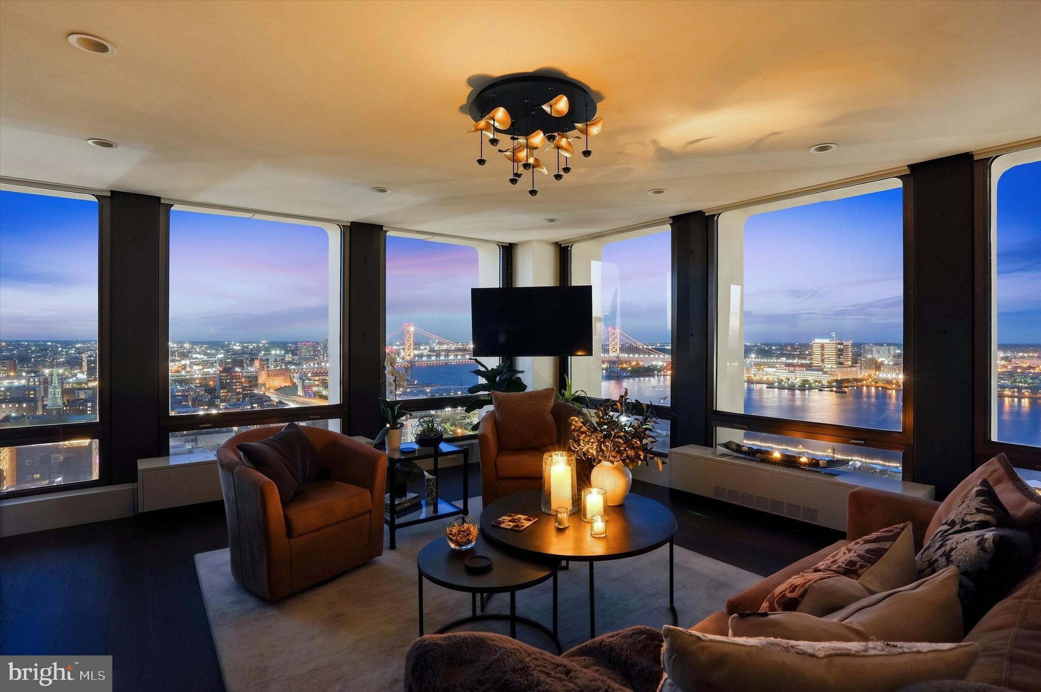 Perched high above the city in Society Hill Towers, this newly renovated corner residence offers a perspective that simply can’t be replicated. From the moment you step inside, your eyes are pulled outward to sweeping, unobstructed views of the Delaware River, the iconic Benjamin Franklin Bridge, and the historic rooftops of Old City.

Nearly 30 floors above it all, the energy of Philadelphia fades into a quiet, almost cinematic experience where the sun shimmers across the water and the bridge lights glow at night. It’s the kind of view that stops you in your tracks and never quite lets you go.

The interior has been thoughtfully reimagined with a sleek, modern design that complements rather than competes with the scenery. Clean lines, refined finishes, and an open flow create a seamless connection between living space and skyline, allowing the view to remain the true focal point from every angle.

This is more than a renovation. It’s a transformation. A home designed to elevate everyday living into something extraordinary.

And once you’re here, you won’t want to leave.

Set on five acres of beautifully landscaped, park-like grounds, Society Hill Towers, designed by I. M. Pei, offers a full-service, low-maintenance lifestyle in the heart of historic Society Hill. Residents enjoy 24/7 concierge and security, all-inclusive utilities, and access to amenities including a seasonal saltwater pool, fitness center, garage parking, and more.

Just outside your door, the on-site plaza features Zahav, a James Beard Award–winning restaurant, along with everyday conveniences like a market, deli, and cleaners. Beyond that, you’re steps from the Delaware River Waterfront and Washington Square Park, with exciting growth ahead. Penn’s Landing Park, a new 11.5-acre civic park currently under construction, will reconnect Center City to the river and create a vibrant, year-round destination.

All of this places you at the center of Society Hill, Old City, and Center City, an effortless, refined city lifestyle.
