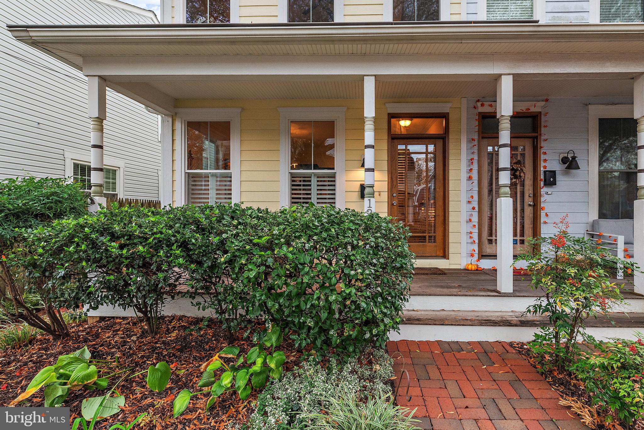 Classic Eastport townhome is light-filled and spacious with warm gleaming wood floors and high ceilings. Inviting front porch opens to formal dining room, updated kitchen and living room that flows to the private backyard. Kitchen has expansive granite counters that are ideal for large parties and have bar seating  for casual dinners. Kitchen opens to living room with 9-foot+ ceilings, gas fireplace with heatilator, and glass door opens to the covered back porch and brick terrace. A private cottage in the back features one bedroom, one bath and living room w/ kitchenette. Perfect for added income! Full lower level in main house includes washer and dryer and is freshly carpeted and has one full bath. Lower level has outdoor entrance. Ideal for additional sleeping area, game room, media room or office. Second level has two large and bright bedrooms each with their own private bath. Fabulous Eastport lower peninsula location with easy walking to all the best restaurants, marinas. yacht clubs, and Annapolis Maritime Museum events.