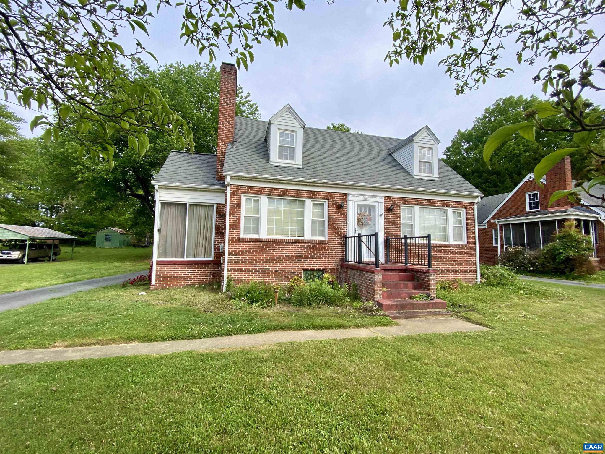 Charming and solid built all-brick home ideally located and walkable to the heart of downtown Gordonsville, where local shops, dining, seasonal events, and small-town charm come together. Inside, timeless hardwood floors add warmth and character throughout much of the home. The inviting living room features a fireplace with a wood stove insert capable of heating the entire home, adding both efficiency and cozy appeal. Offering a flexible layout with a MAIN LEVEL BEDROOM plus two additional bedrooms upstairs, this home blends comfort and functionality. Enjoy not one, but TWO SUNROOMS?one conveniently located off the living room with easy access from the paved driveway, and another heated sunroom off the kitchen overlooking the backyard, creating comfortable year-round living spaces. Outside, the long paved driveway provides abundant parking and leads to a spacious detached garage complete with a workbench, ideal for hobbies, storage, or projects. Conveniently located near multiple award-winning wineries, vineyards, and historic attractions, this property offers the perfect opportunity to enjoy the beauty, history, and lifestyle Central Virginia is known for.,Fireplace in Living Room