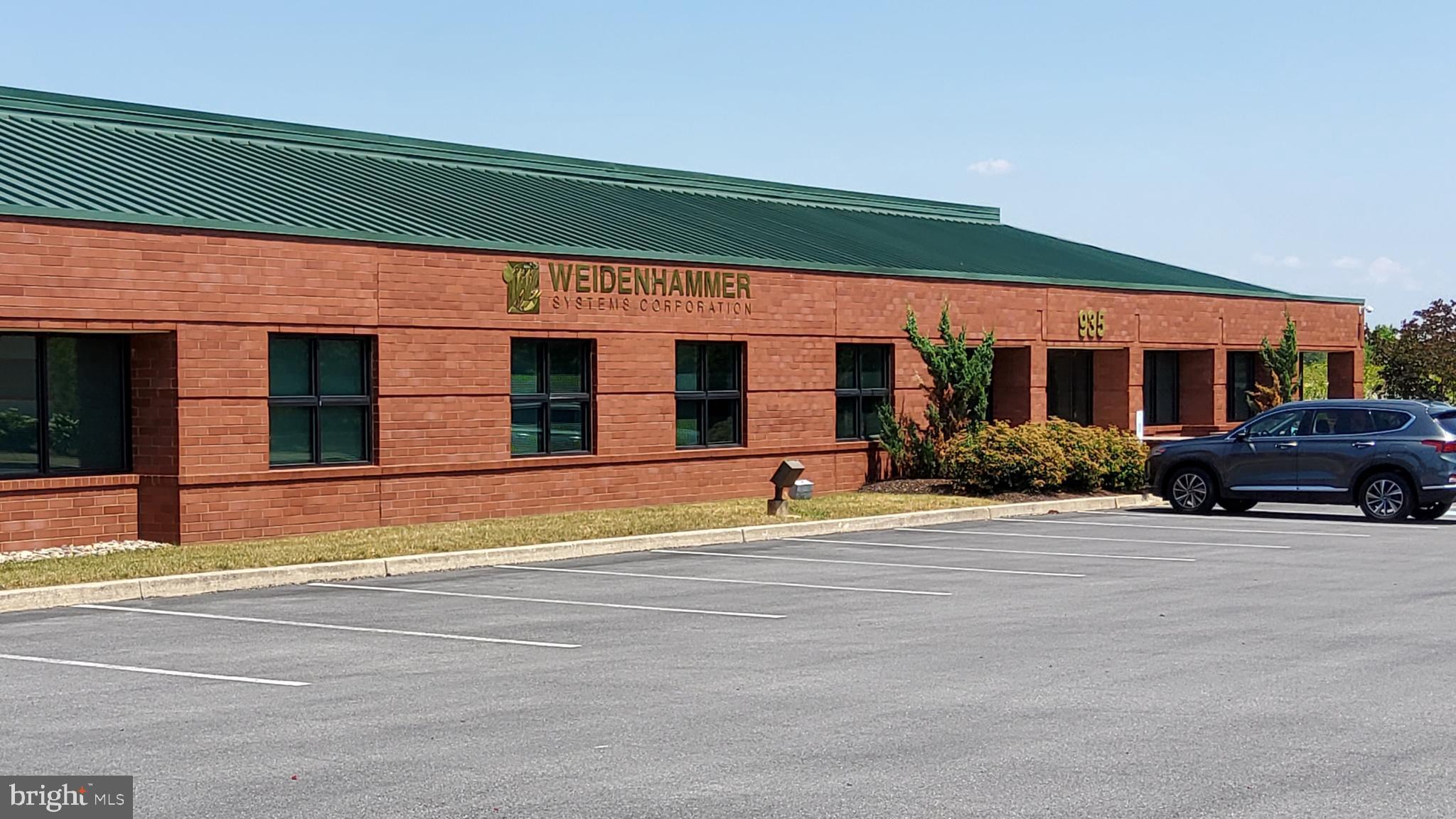 **For Sale: 935 Berkshire Blvd, Wyomissing, PA – Prime Class A Office Space**

This 20,800 square foot, single-story, Class A office building is now available for sale in the prestigious Wyomissing Corporate Center. Built to high standards in 1994, this multi-tenant property offers an exceptional opportunity for businesses seeking a professional office location in Berks County, with close proximity to other corporate offices, retail centers, and dining options.

**Property Highlights:**
- **Size:** 20,800 sq. ft. of flexible office space
- **Location:** Wyomissing Corporate Center, a prime business hub
- **Year Built:** 1994, meticulously maintained
- **Layout:** Features a large lobby with a secretarial/greeting area, an executive office suite with a private restroom, numerous private offices, several conference/training rooms, a spacious call center-style cubicle area, and a kitchenette.
- **IT Infrastructure:** Includes a dedicated IT room with raised floors, UPS with a 15 KVA load capacity, dual AC units, and telecommunications served by Tier 1 fiber optic providers such as Comcast, Verizon, and AT&T.
- **Backup Power:** The building is supported by a KOHLER 80 KVA diesel generator capable of running for 48 hours under load.
- **Parking:** 110 surface parking spaces.
- **Additional Income Potential:** The 5,000 sq. ft. West Building, currently leased for $6,180/month, provides additional income. The lease is renewable annually with 5 months' notice for termination.

Located within the highly desirable Wyomissing Borough, 935 Berkshire Blvd is part of a thriving business district. Berks County itself is a growing economic region, home to major corporations, financial institutions, and a well-established healthcare industry. This location offers easy access to highways, making it a convenient and strategic choice for any enterprise looking to expand or establish a presence in the area.

For more information, floor plans, or to schedule a viewing, contact us today. This is an outstanding opportunity to own a premier property in one of Berks County's most sought-after locations