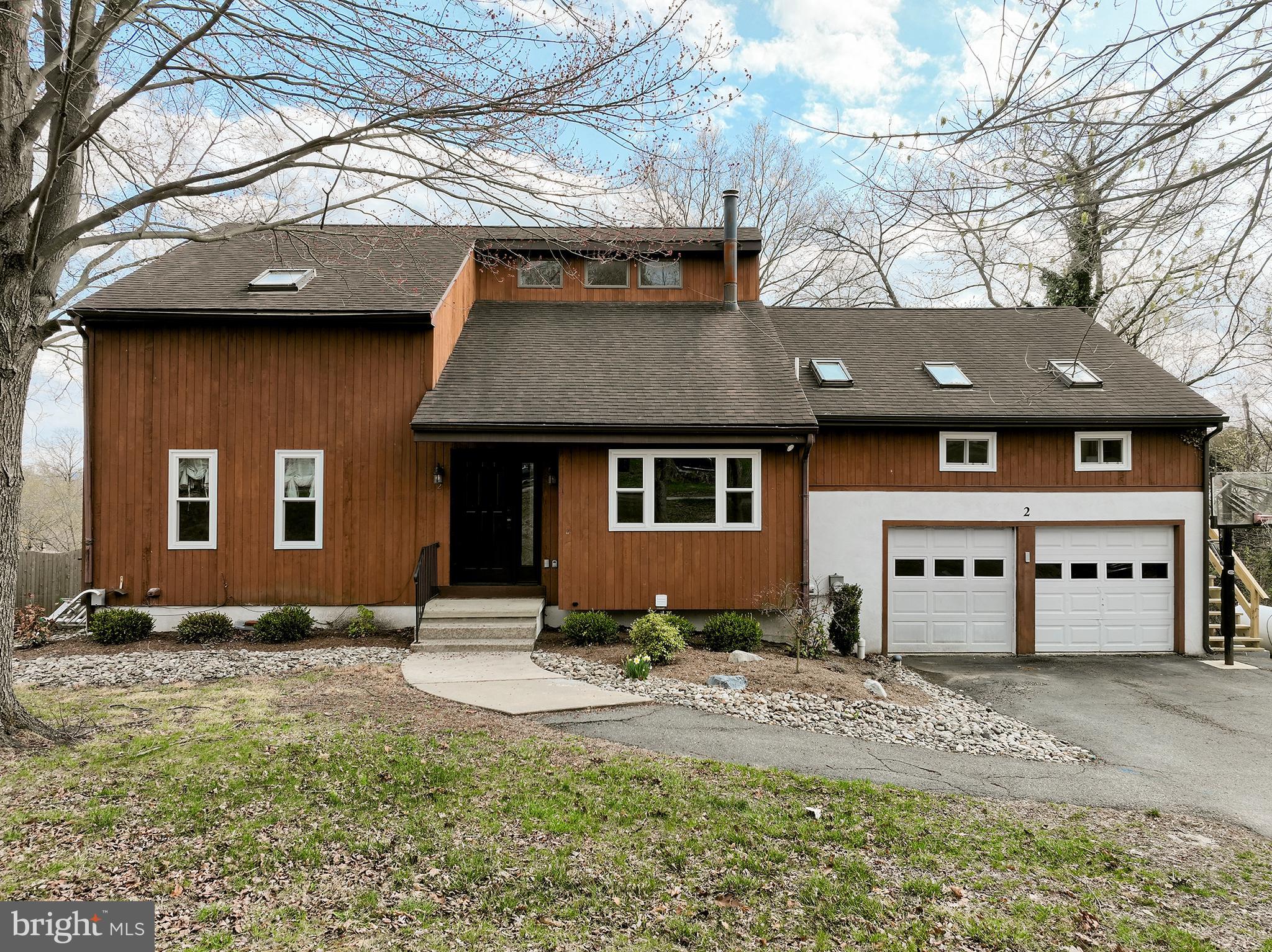 At the end of a long driveway sits this beautiful single 2 story wood contemporary home ready for its new owners.  You won't need a vacation when living in this amazing property which features a beautiful built-in pool with a large hardscaped surround, a deck off the kitchen eating area and a princess balcony off the main bedroom!  This home provides you with beautiful wooded views and the River without the flood insurance.  A beautiful large living room with vaulted ceilings, hardwood flooring and wood stove great you up entry and leads to a formal dining room with hardwood floors and beautiful views and onto the eating area of the kitchen w/pantry and sliding doors to a rear deck and entry to the bright kitchen!  The kitchen offers you a built-in microwave, stainless double door refrigerator and recessed lighting.  Additionally on this floor you will find a bedroom and a full bath!  The treck deck overlooks the pool area and features stairs to the rear area!  The 2nd level of this home features a large bedroom with a 8x16 walk in closet, princess balcony and a jack and jill bathroom connecting to this room and the 3rd bedroom which provides additional space with a loft!  Moving on this floor provides you with an in-law suite/additional living space which features a living room with wood burning stove & parquet floors, full bath, bedroom and small kitchenette!  This area does have electric baseboard heat and new stairs leading to the exit.  Do not miss the basement with a 16x13 finished room and an additional finished area.  There is a pool equipment storage room as well as laundry area and entry to the 2 car attached garage!  Outside you will find an additional 1 car oversized garage.  The heater was replaced in 2020 and the roof in 2014.  This house is walkable to Downtown Phoenixville and you will never want to leave.  Private and peaceful and filled with amazing memories waiting to be made.