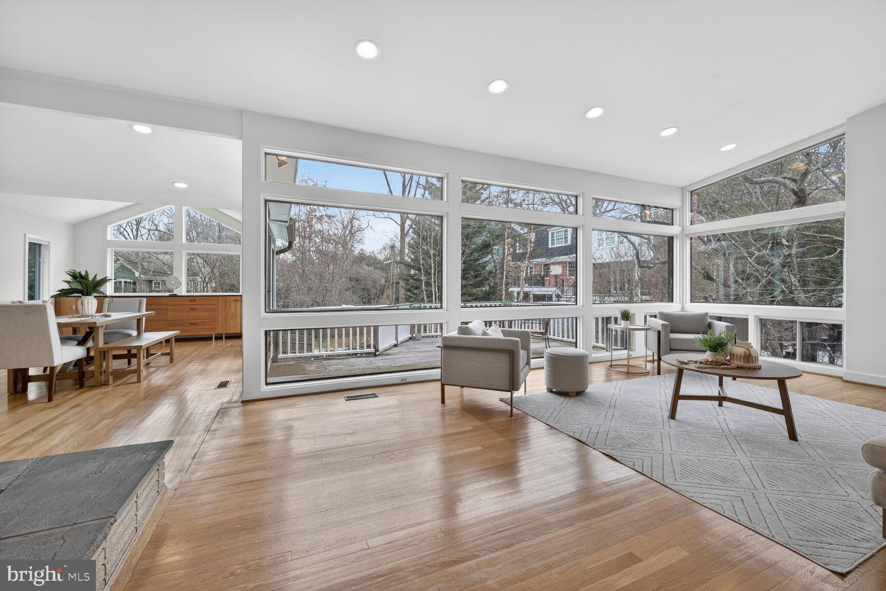Surprisingly spacious mid-century modern on four levels in the heart of Glen Echo Heights. This sun-filled contemporary has full-height picture windows in the living room, plus a large dining room opening to an expansive Epay deck, ready for al fresco dining when the weather warms up. The updated kitchen boasts stainless appliances, quartz counters, maple cabinets and a breakfast nook. Gleaming hardwoods and new luxury vinyl planks throughout much of home. The upper level has a primary bedroom with three closets and an updated ensuite bath, plus two additional bedrooms with full hall bath. A 4th bedroom and 3rd full bath on Lower Level #1 could be great for guests or teens, with handy egress to side yard. The bottom level features a generous recreation room with fireplace - perfect for entertaining and getting cozy; an adjacent bonus room serves as a tucked-away office. Walk out to large, fenced, flat back yard. Walking distance in one direction to shops, retail, dining, and the Ride-On Bus - and the C&O Canal, Potomac River and Glen Echo Park in the other direction, with easy access via the Clara Barton Parkway to downtown DC, Virginia and the Beltway.